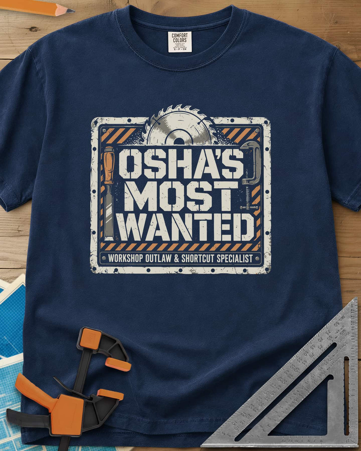 OSHA'S Most Wanted heavyweight tee in Navy, a saw blade, chisel and C-clamp around a hazard-striped plate