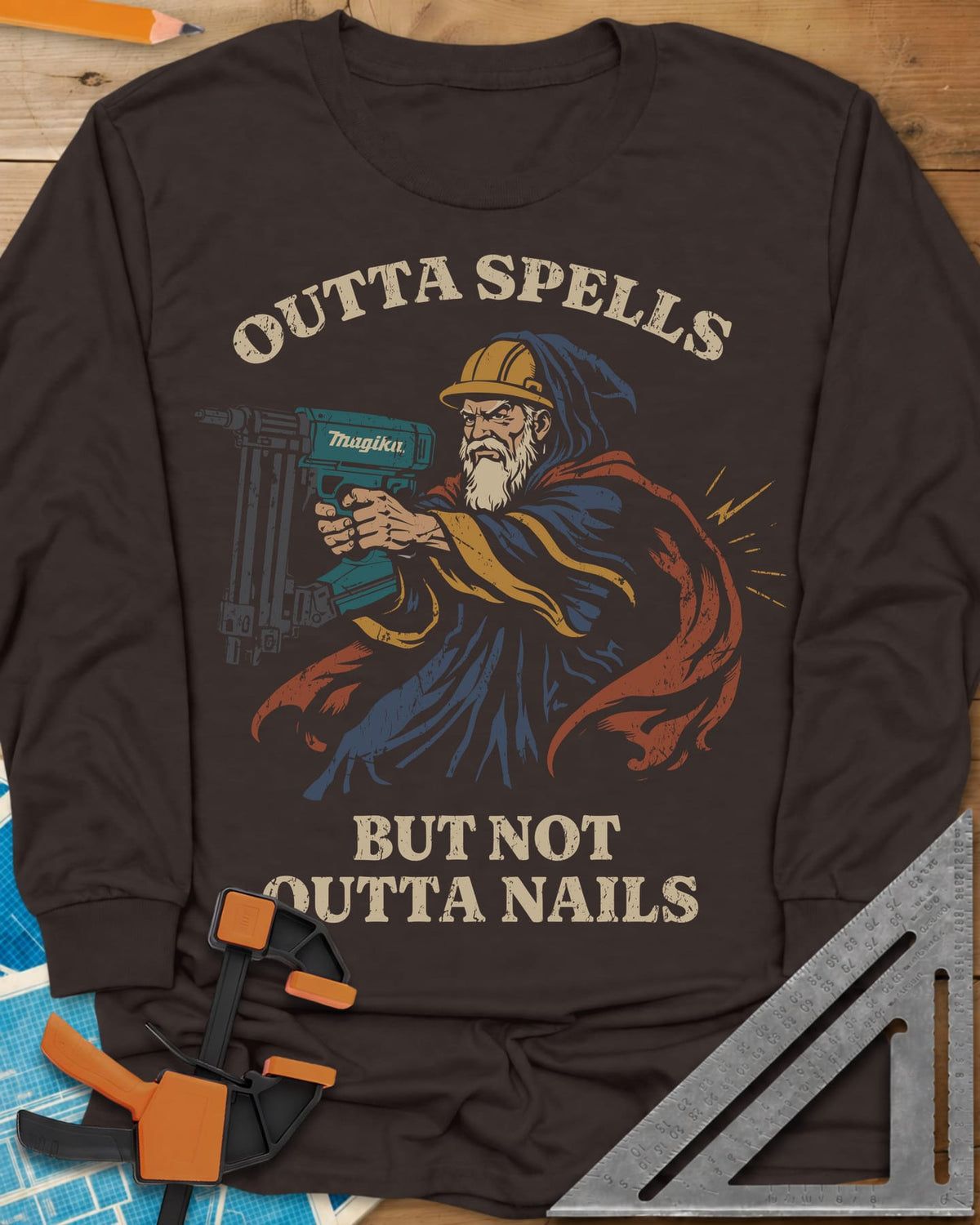 Outta Spells But Not Outta Nails long sleeve shirt in Dark Chocolate, a bearded wizard in a hard hat aiming a teal nail gun