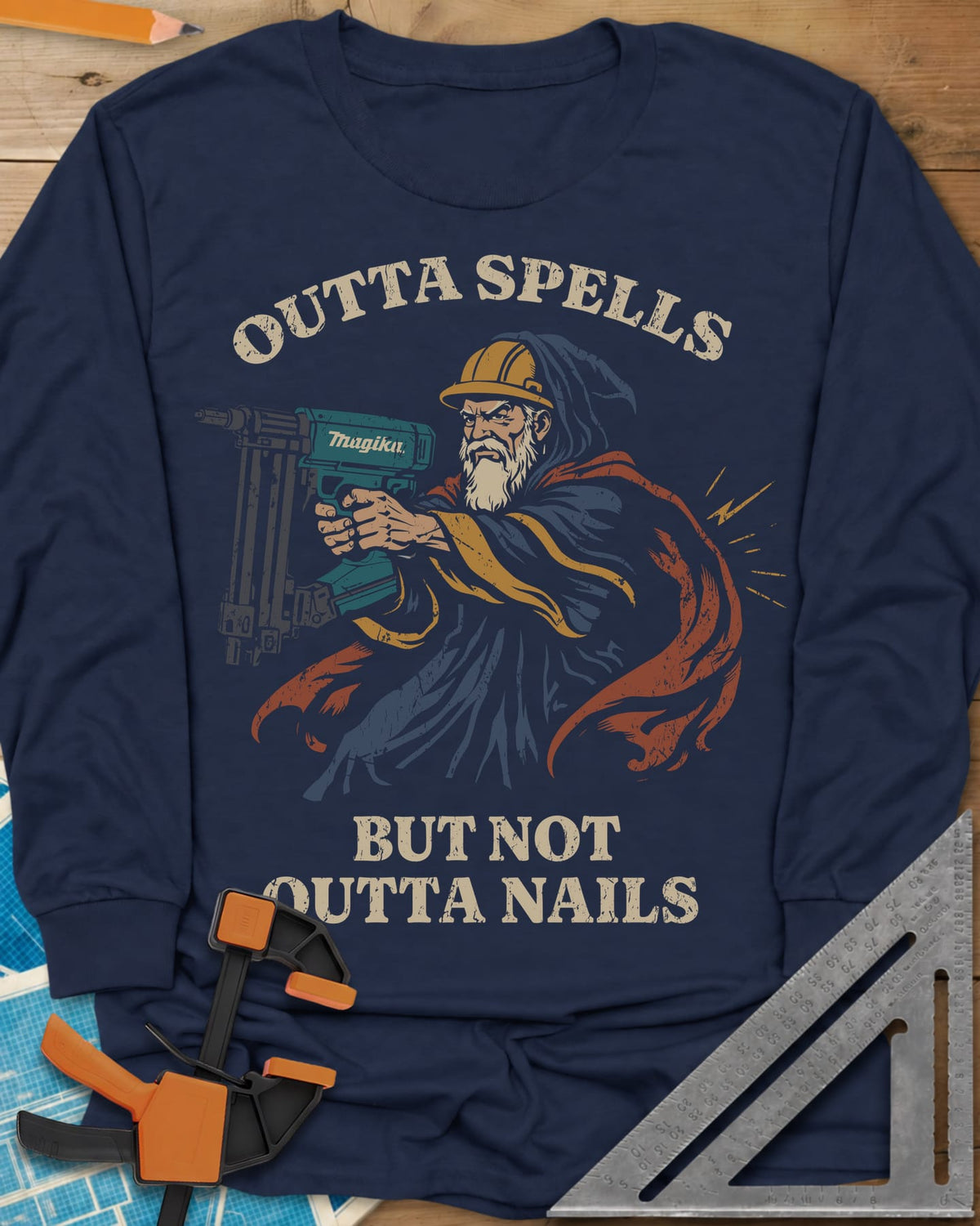Outta Spells But Not Outta Nails long sleeve shirt in Navy, a bearded wizard in a hard hat aiming a teal nail gun