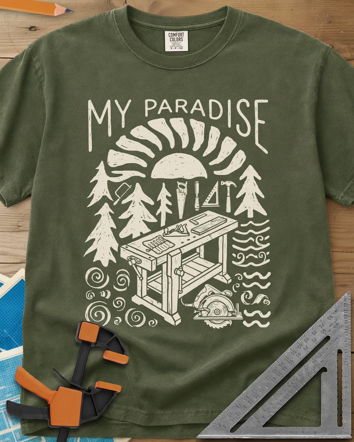 Paradise Workshop heavyweight tee in Hemp, linocut sun, pines, hand tools and a workbench with a plane