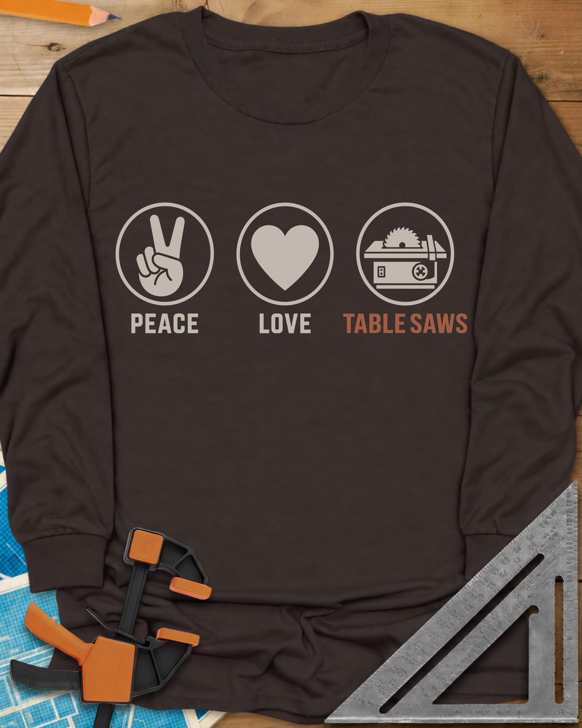 Peace Love Table Saws long sleeve shirt in Dark Chocolate, three circled icons: a peace sign, a heart and a table saw