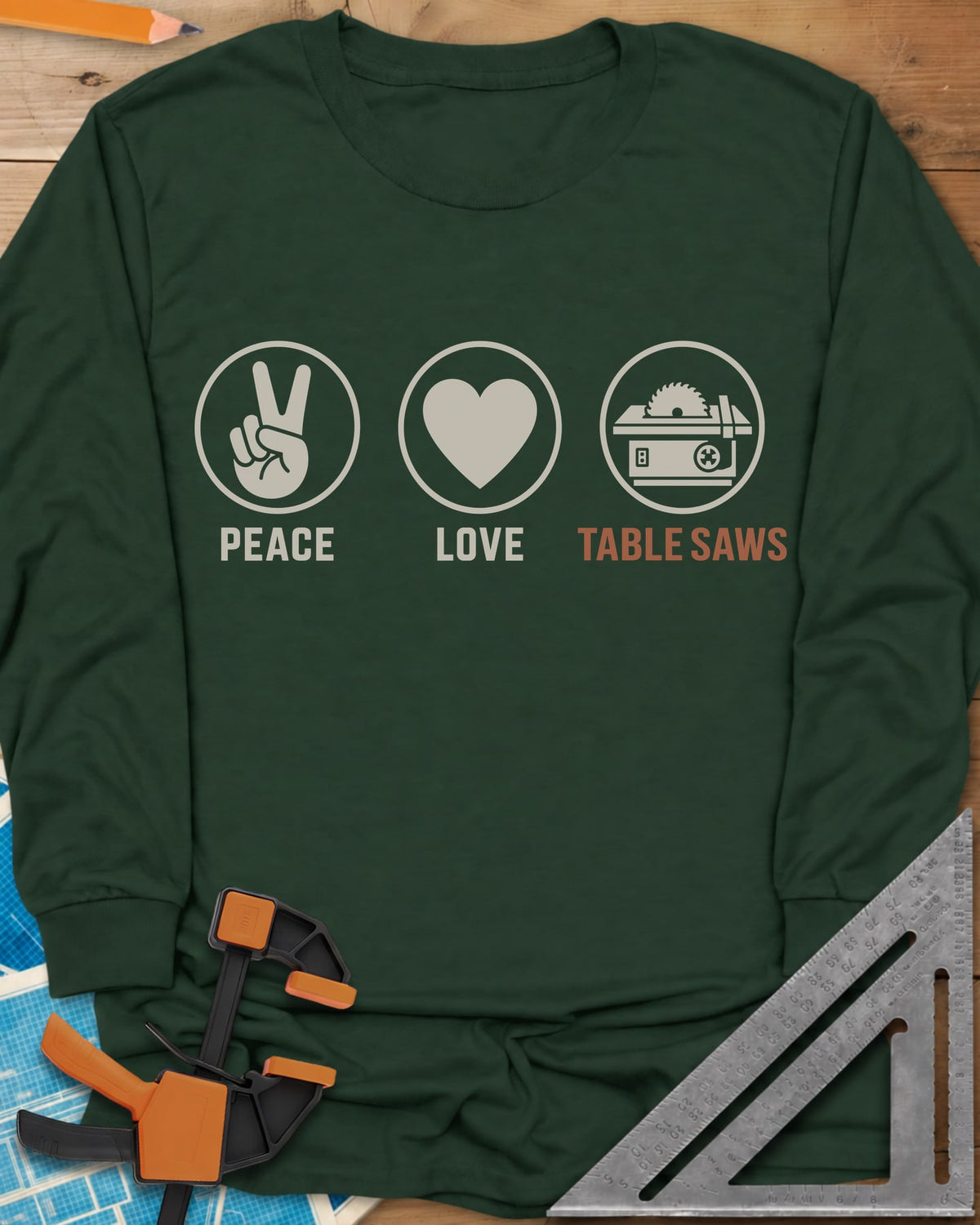 Peace Love Table Saws long sleeve shirt in Forest Green, three circled icons: a peace sign, a heart and a table saw
