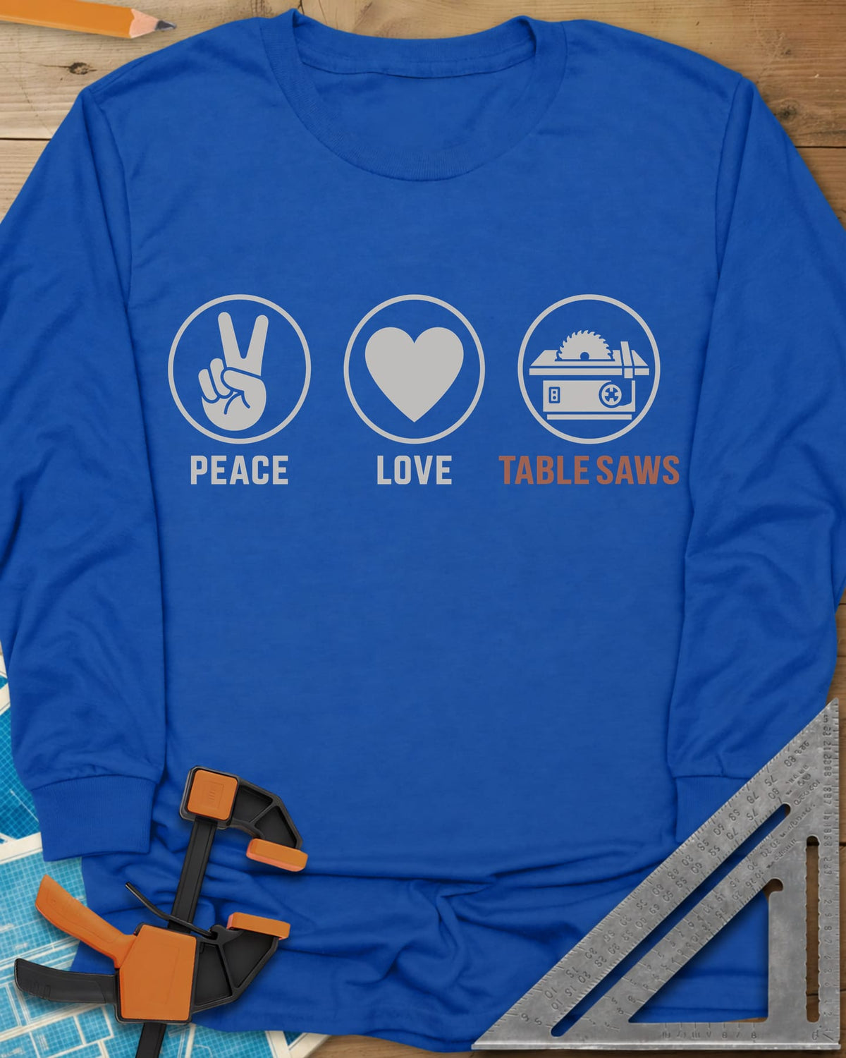 Peace Love Table Saws long sleeve shirt in Royal, three circled icons: a peace sign, a heart and a table saw