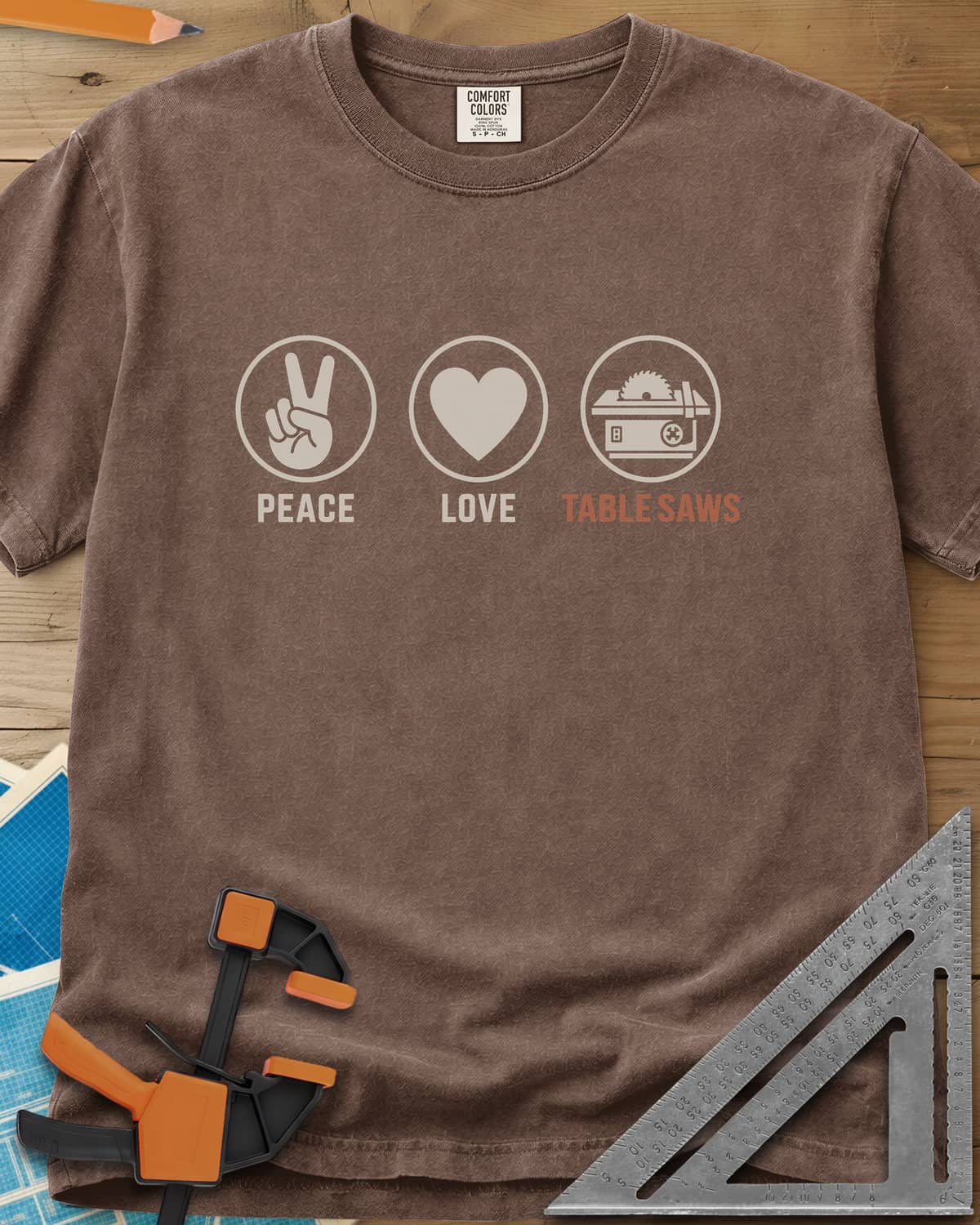 Peace Love Table Saws heavyweight tee in Espresso, three circled icons: a peace sign, a heart and a table saw