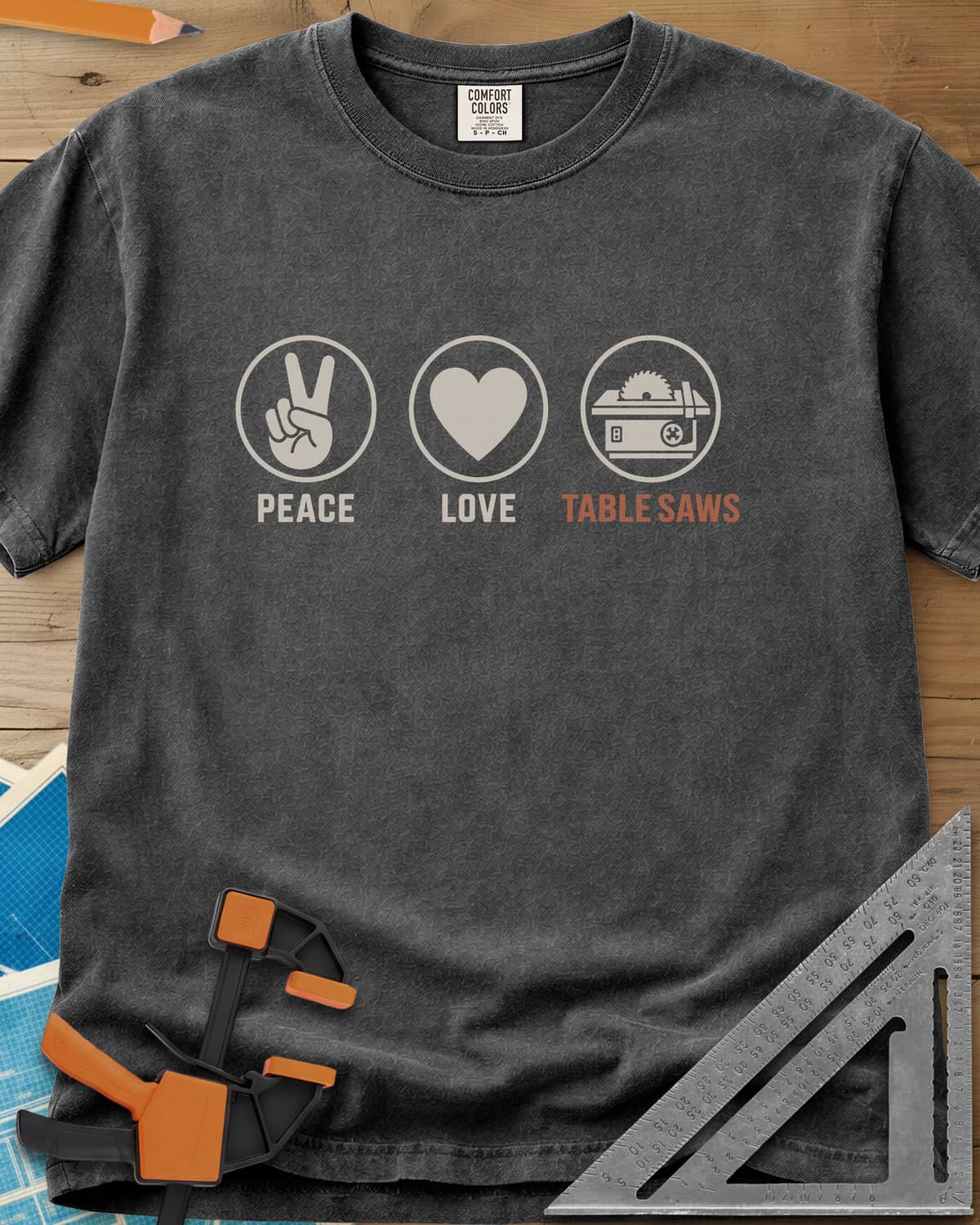 Peace Love Table Saws heavyweight tee in Pepper, three circled icons: a peace sign, a heart and a table saw