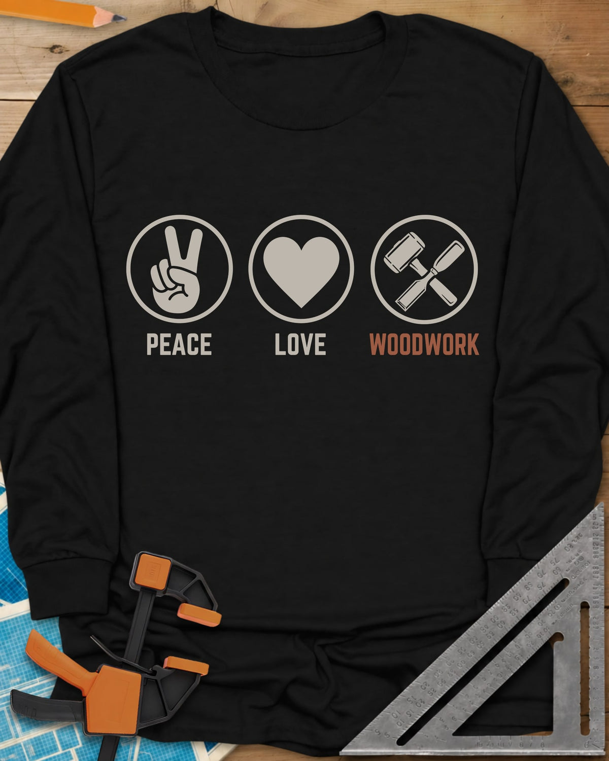 Peace Love Woodwork long sleeve shirt in Black, three circled icons: a peace sign, a heart, a mallet and chisel