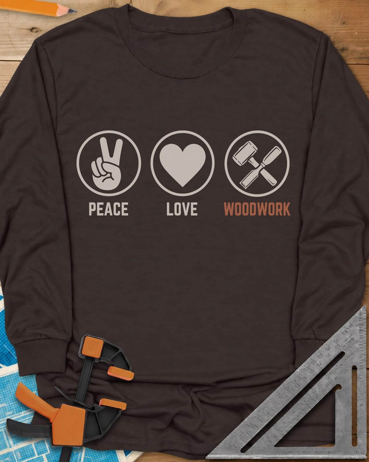 Peace Love Woodwork long sleeve shirt in Dark Chocolate, three circled icons: a peace sign, a heart, a mallet and chisel