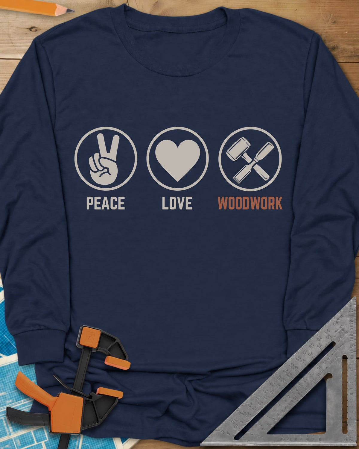Peace Love Woodwork long sleeve shirt in Navy, three circled icons: a peace sign, a heart, a mallet and chisel