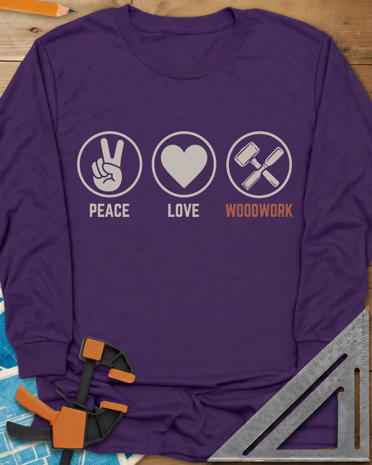 Peace Love Woodwork long sleeve shirt in Purple, three circled icons: a peace sign, a heart, a mallet and chisel