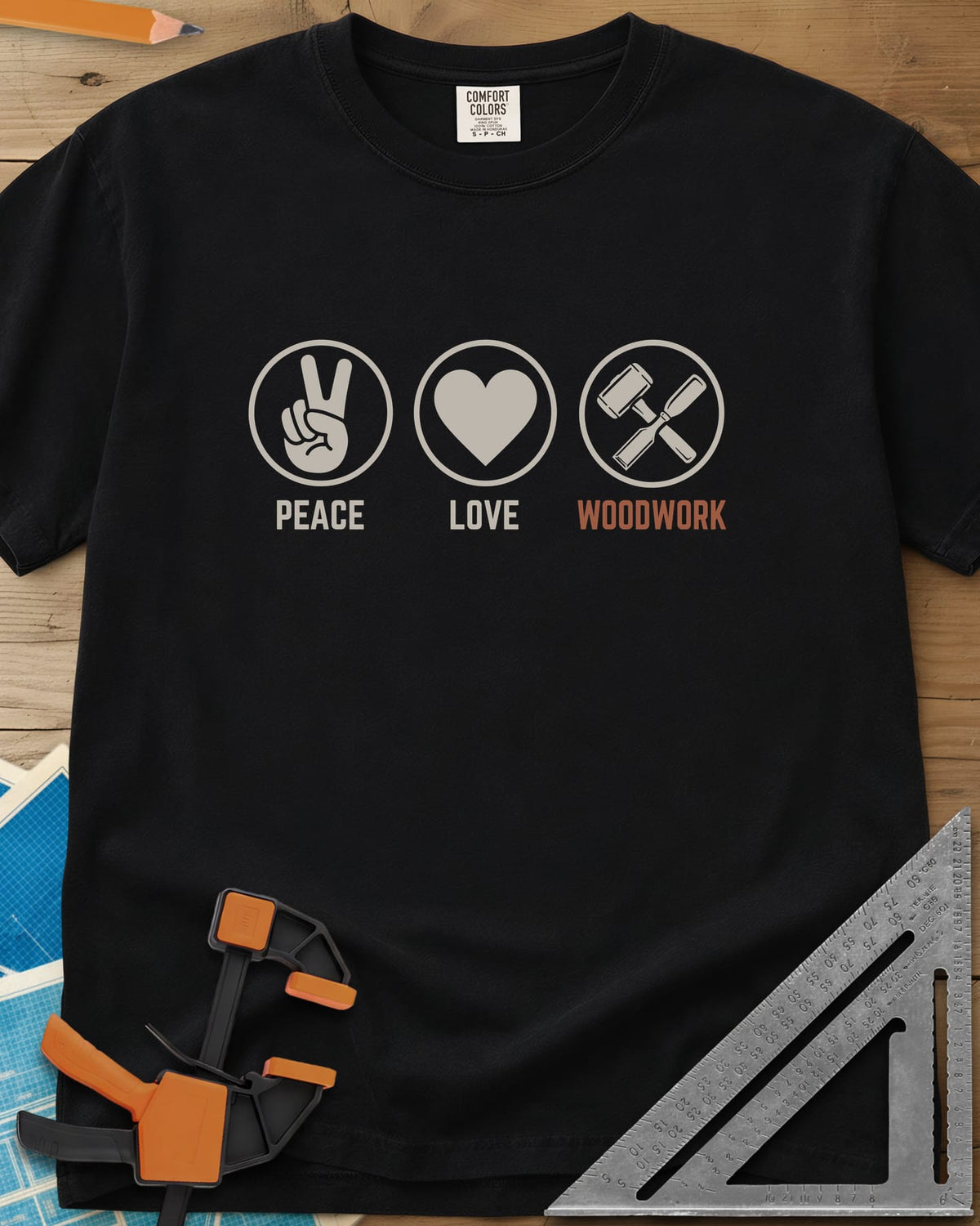 Peace Love Woodwork heavyweight tee in Black, three circled icons: a peace sign, a heart, a mallet and chisel