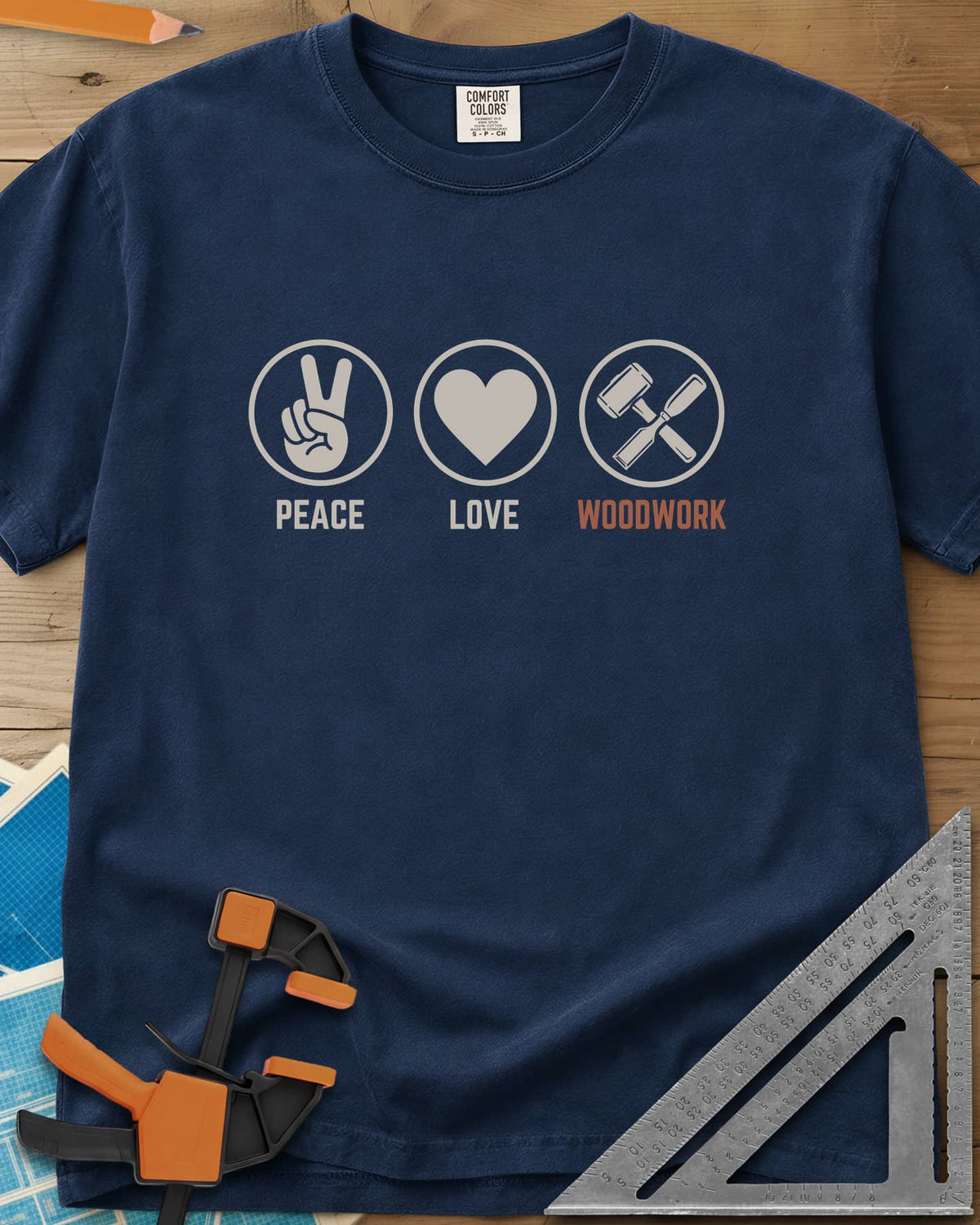 Peace Love Woodwork heavyweight tee in Navy, three circled icons: a peace sign, a heart, a mallet and chisel