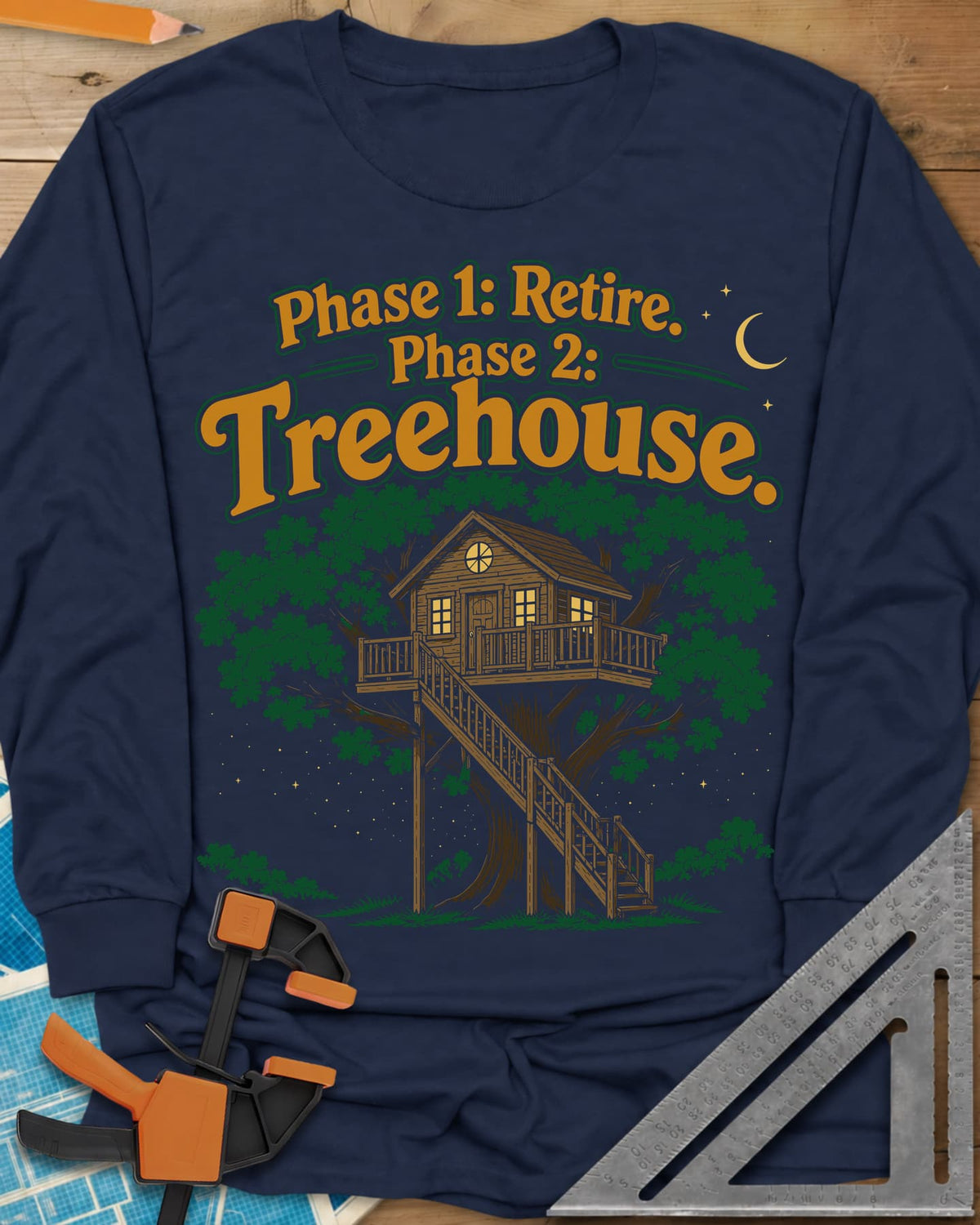 Phase 1 Retire Phase 2 Treehouse long sleeve shirt in Navy, a lit treehouse with a deck and long staircase under a night sky