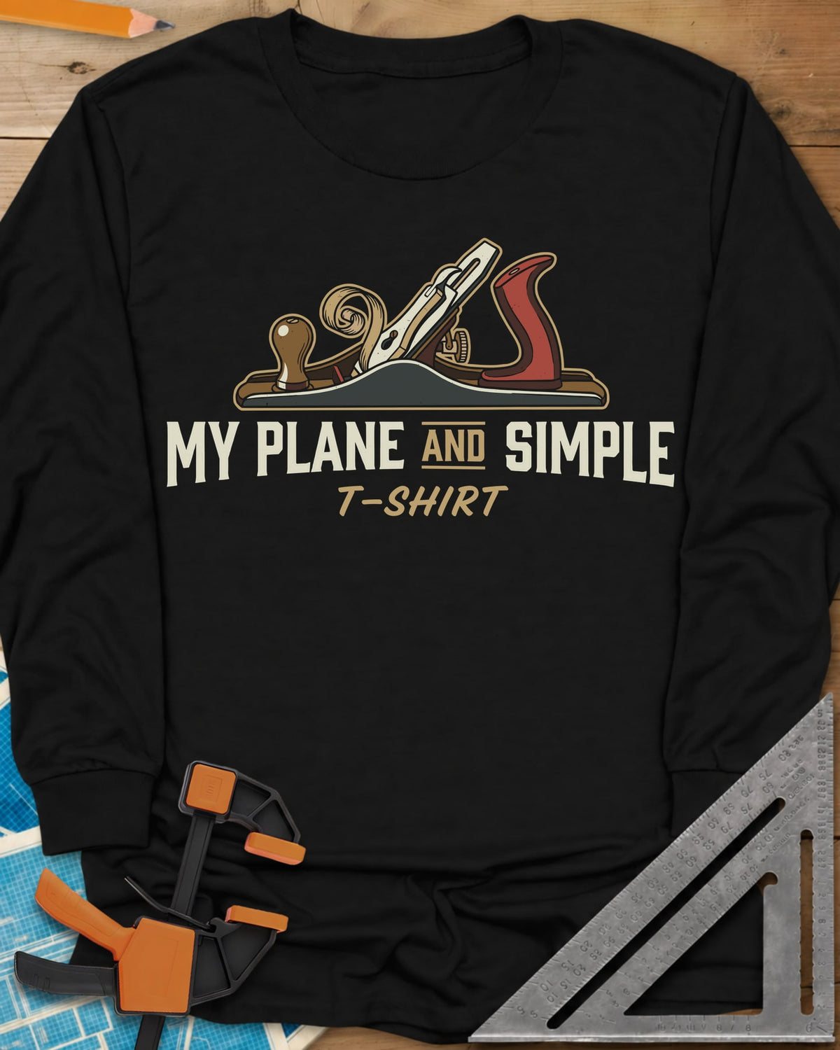Plane and Simple long sleeve shirt in Black, a hand plane with a wood curl above a pun caption