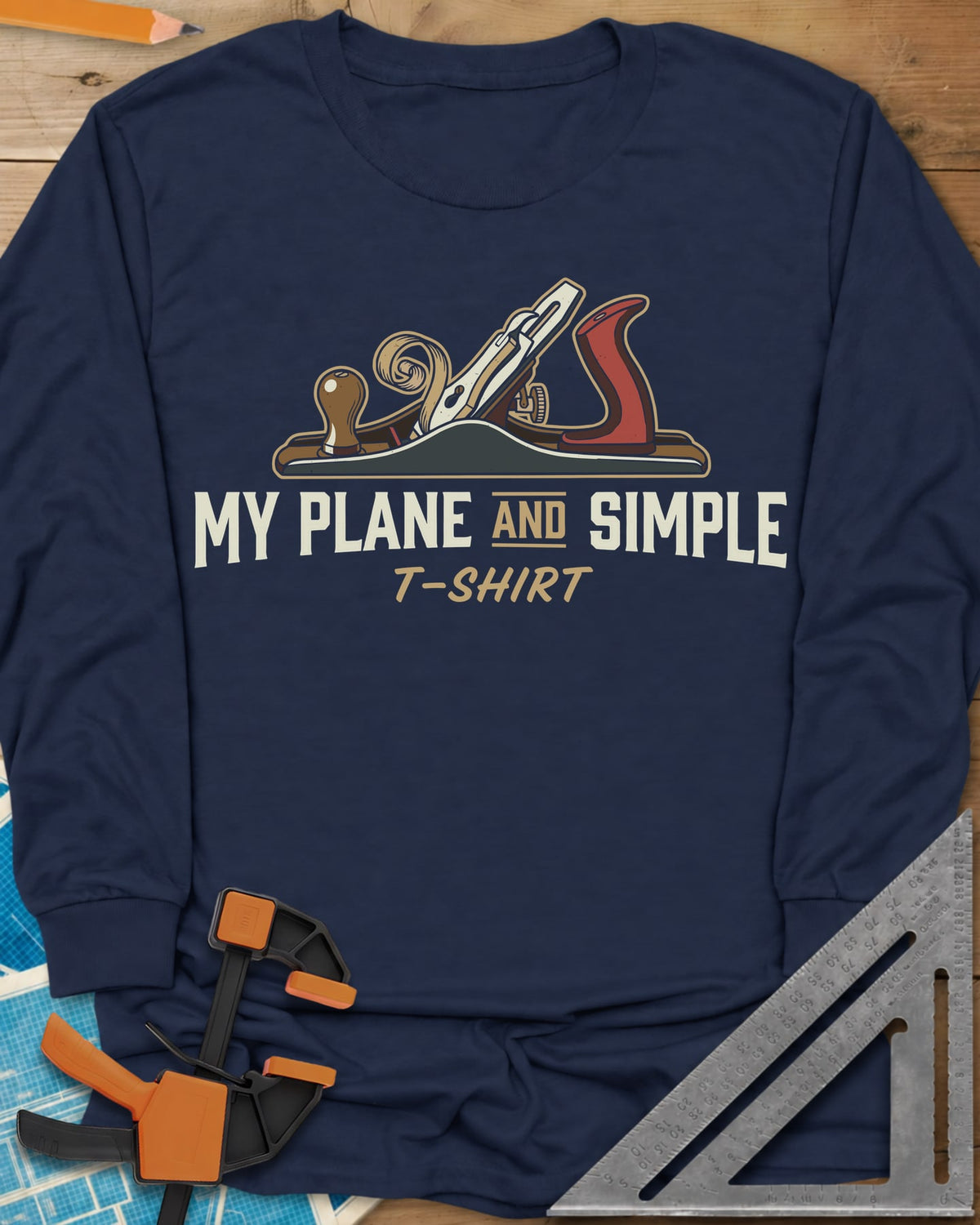 Plane and Simple long sleeve shirt in Navy, a hand plane with a wood curl above a pun caption