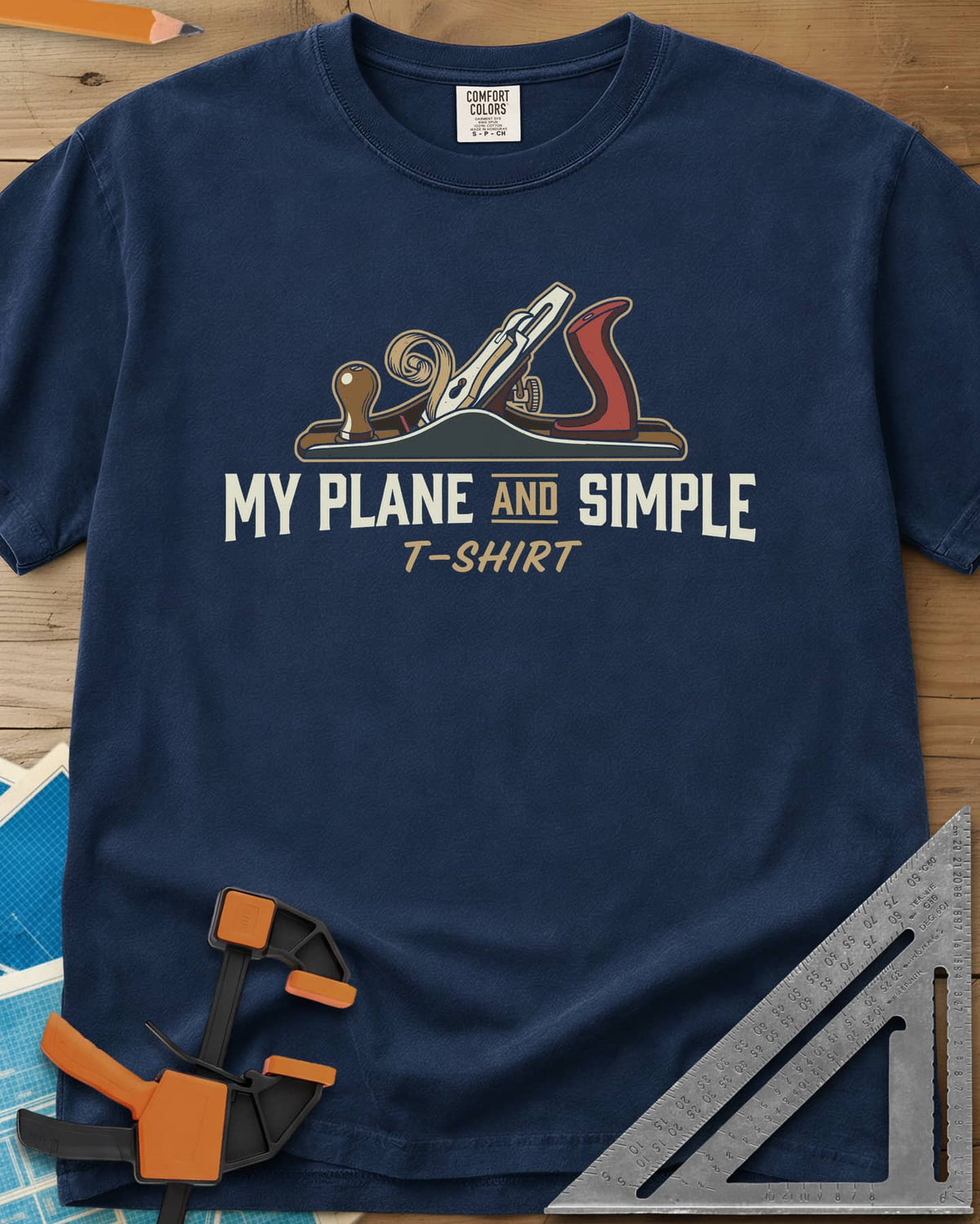 Plane and Simple heavyweight tee in Navy, a hand plane with a wood curl above a pun caption