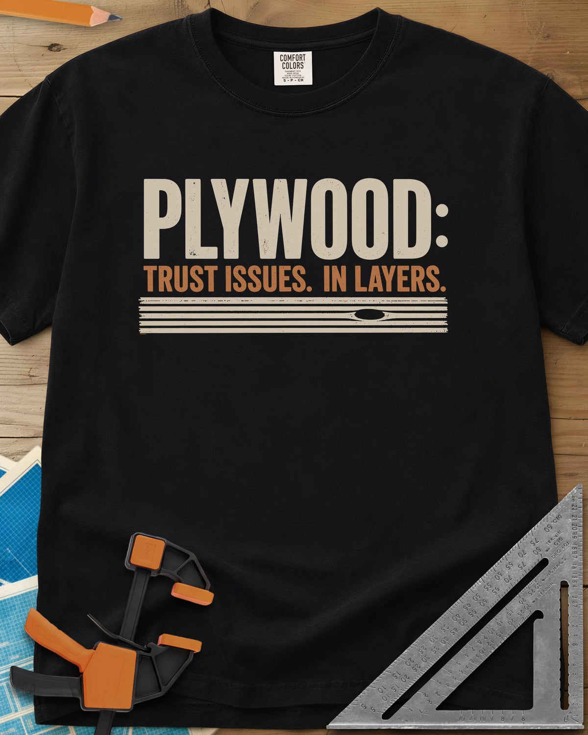 Plywood Trust heavyweight tee in Black, striped plywood layers with an oval knot patch