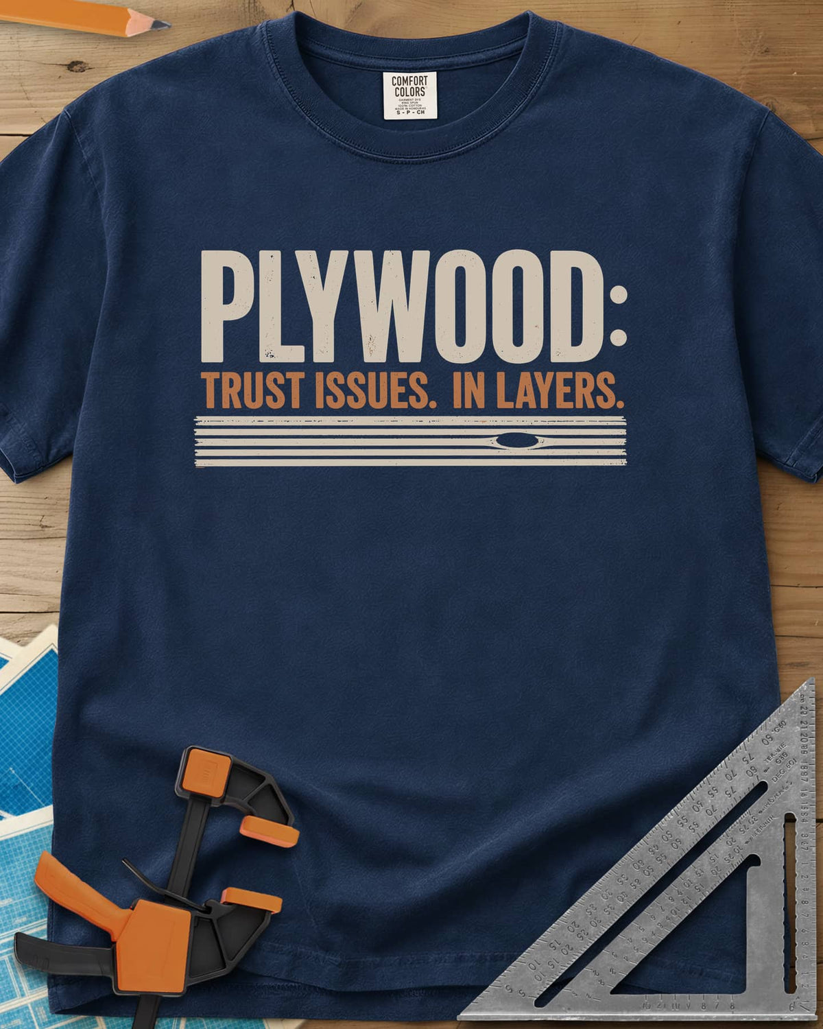 Plywood Trust heavyweight tee in Navy, striped plywood layers with an oval knot patch