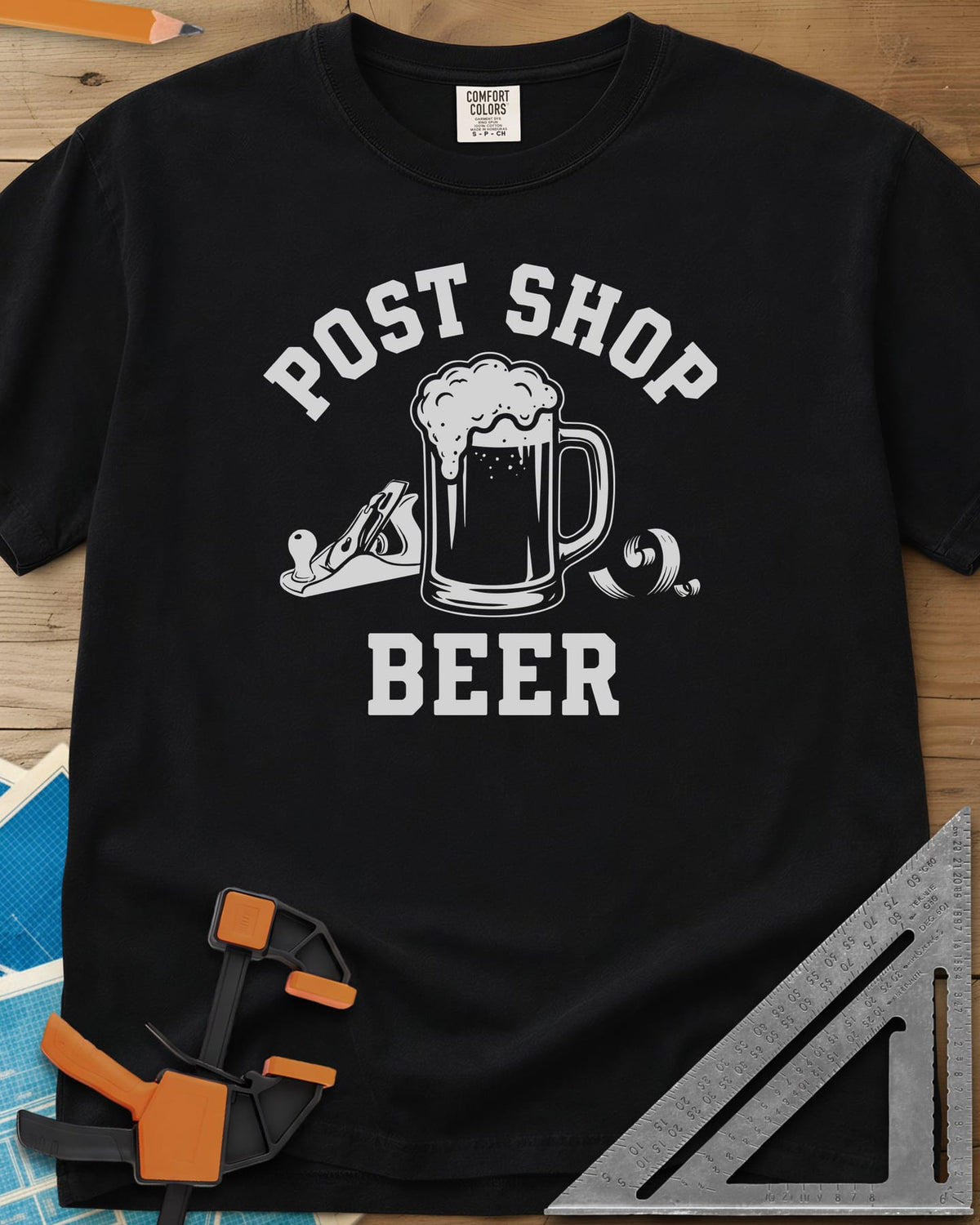 Post Shop Beer Woodworking heavyweight tee in Black, a frothy beer mug flanked by a hand plane and a wood shaving