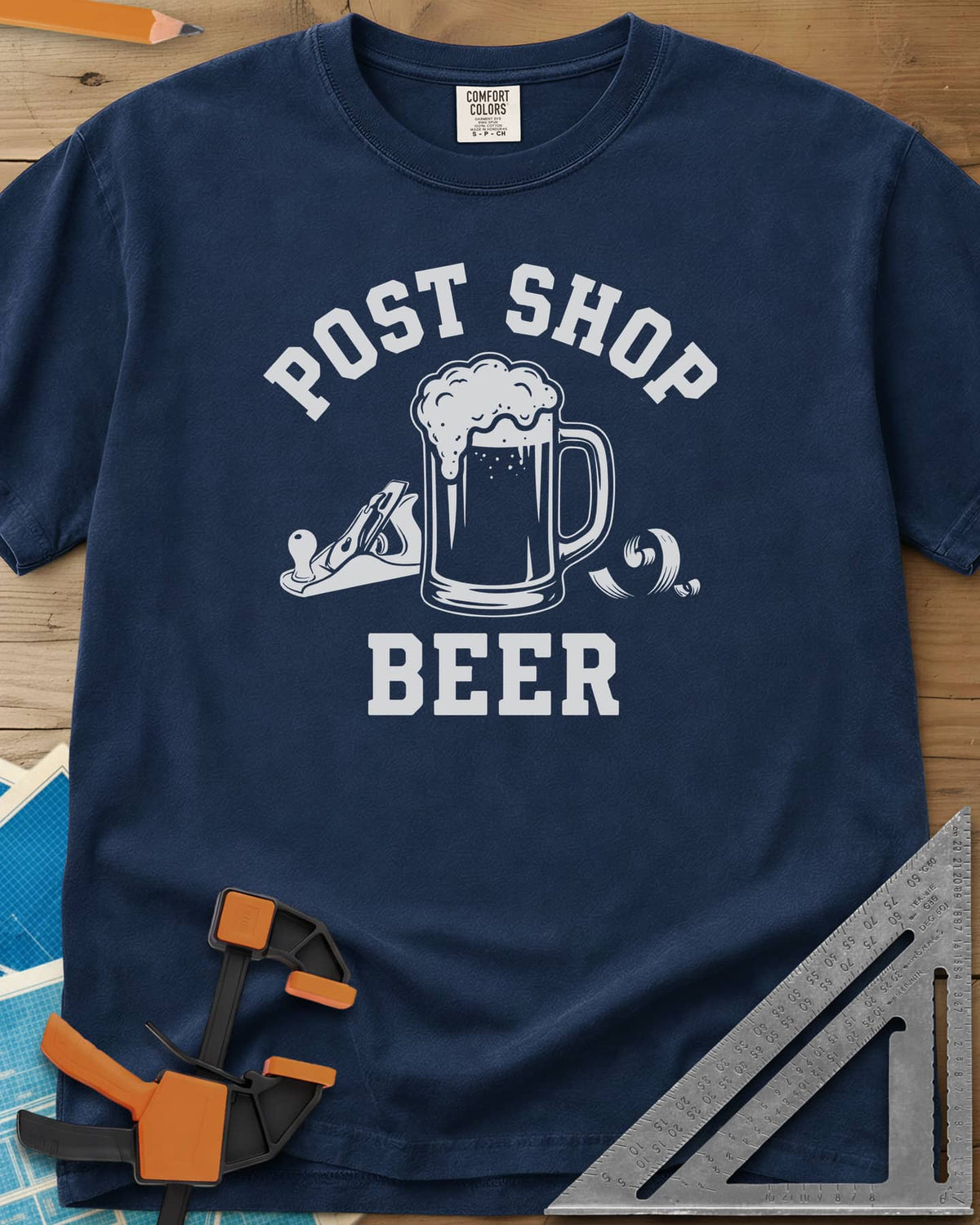 Post Shop Beer Woodworking heavyweight tee in Navy, a frothy beer mug flanked by a hand plane and a wood shaving