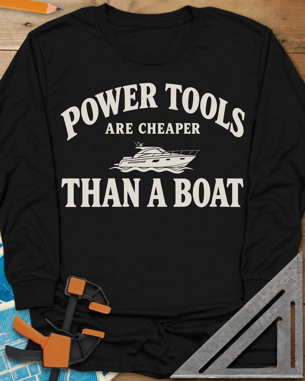 Power Tools Are Cheaper Than A Boat long sleeve shirt in Black, a line-drawn motor yacht on waves between the words