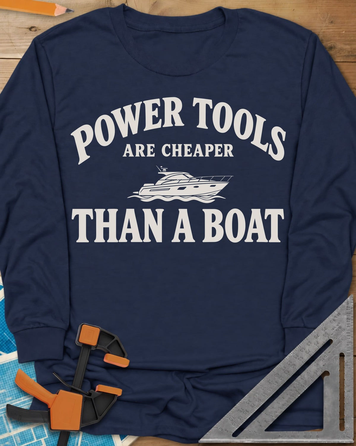 Power Tools Are Cheaper Than A Boat long sleeve shirt in Navy, a line-drawn motor yacht on waves between the words