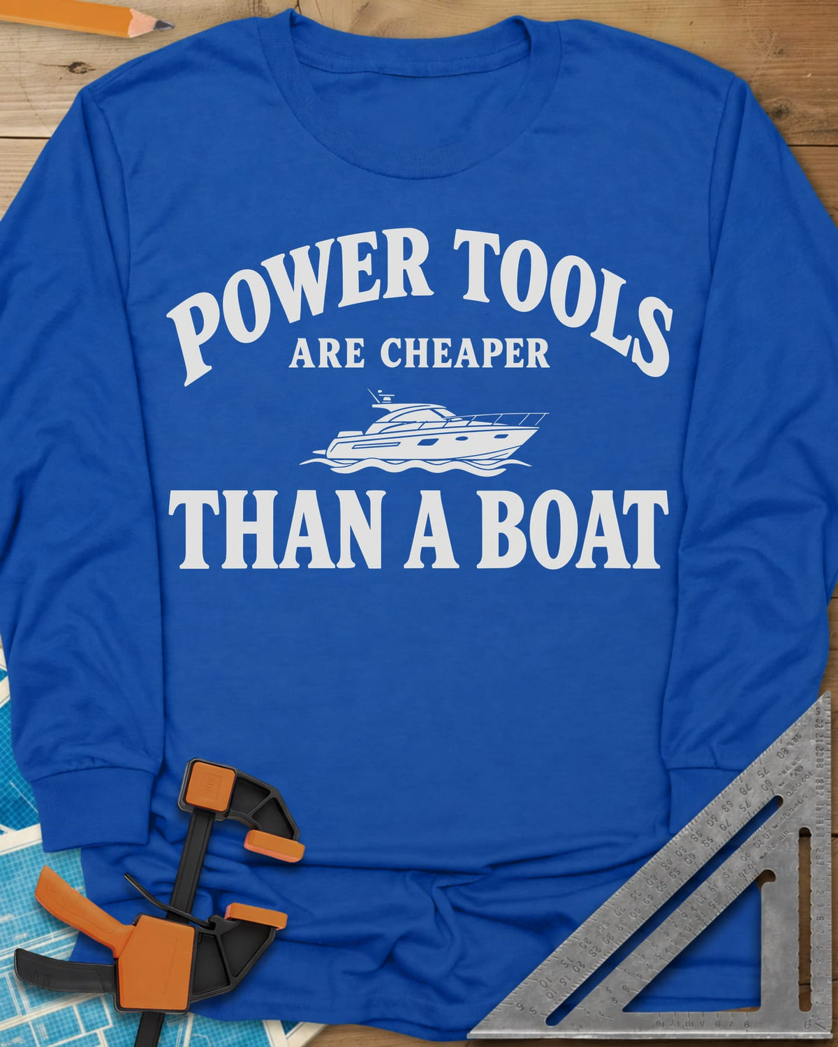 Power Tools Are Cheaper Than A Boat long sleeve shirt in Royal, a line-drawn motor yacht on waves between the words