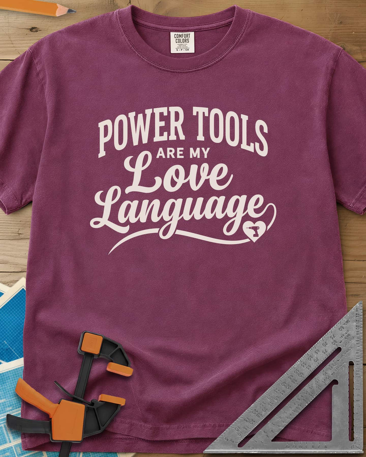 Power Tools Are My Love Language heavyweight tee in Berry, script lettering with a swash ending in a heart holding a drill