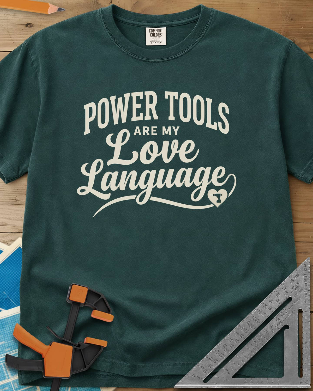 Power Tools Are My Love Language heavyweight tee in Blue Spruce, script lettering with a swash ending in a heart holding a