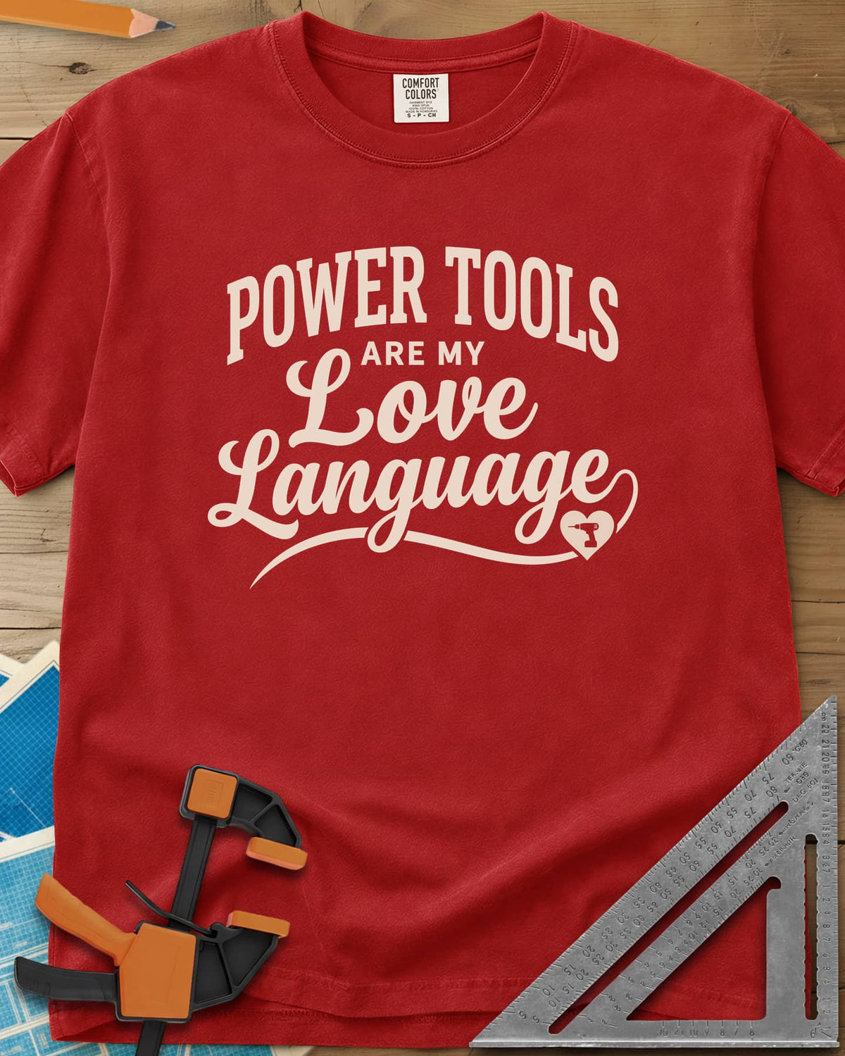Power Tools Are My Love Language heavyweight tee in Red, script lettering with a swash ending in a heart holding a drill