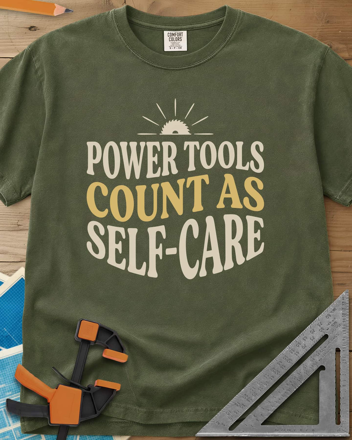 Power Tools Count As Self-Care heavyweight tee in Hemp, wavy stacked lettering under a half saw blade rising like a sun