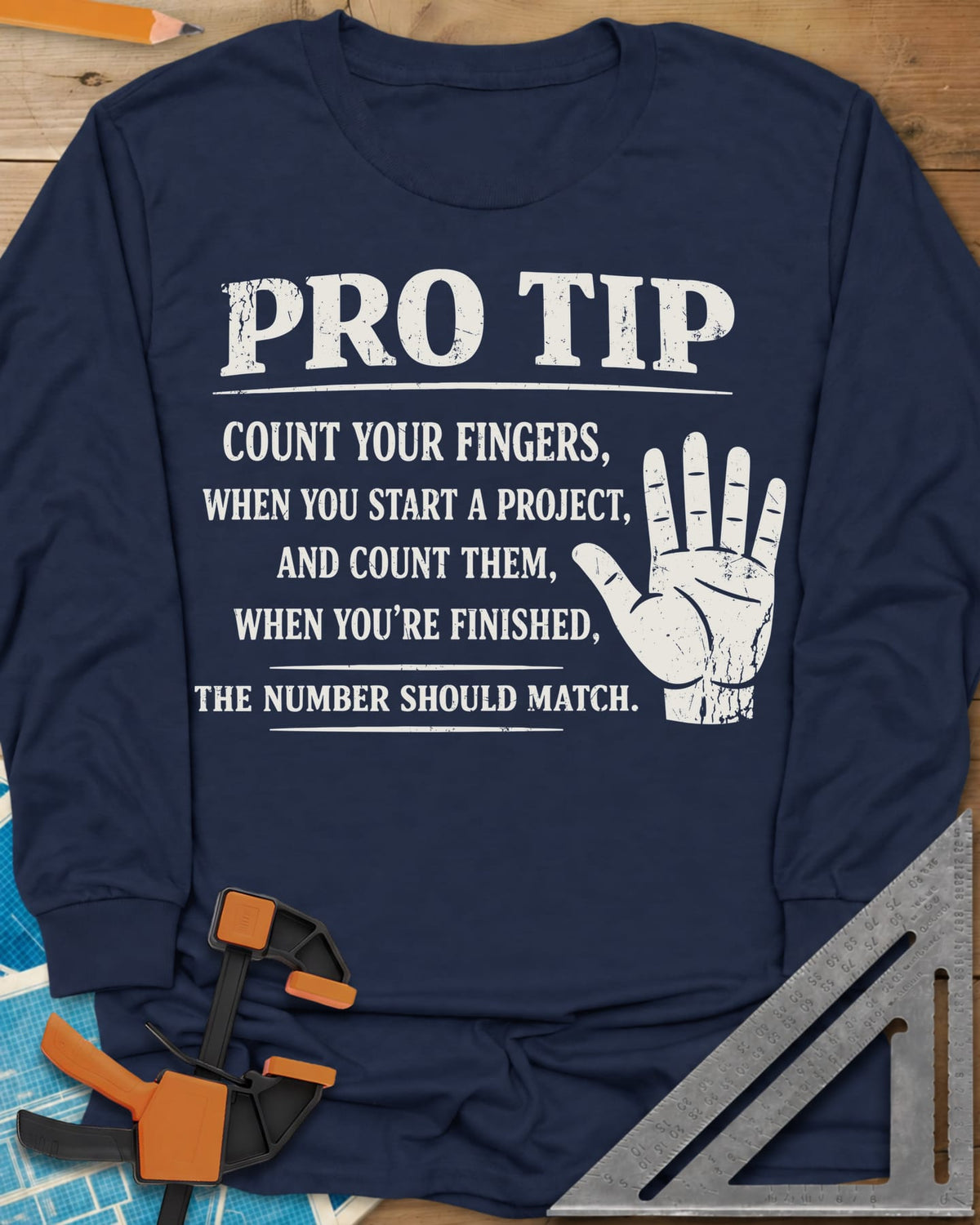 Pro Tip long sleeve shirt in Navy, a raised open hand beside a shop-safety tip about counting fingers