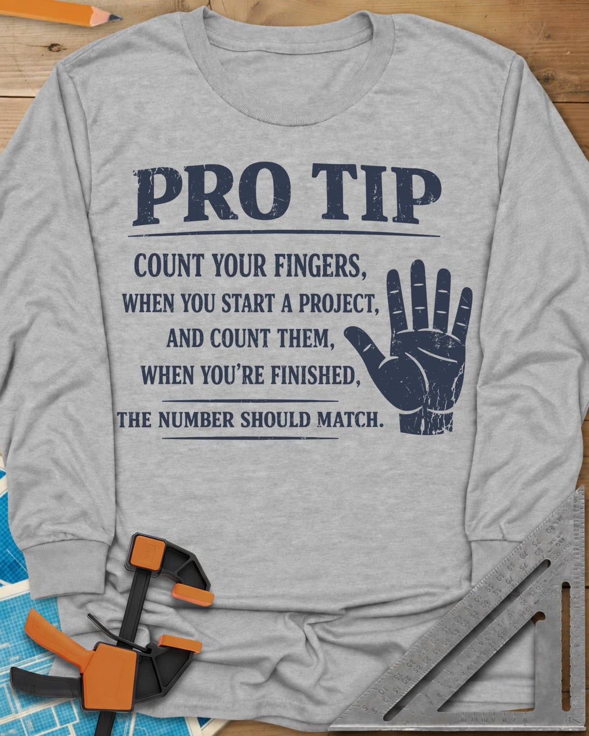 Pro Tip long sleeve shirt in Sport Grey, a raised open hand beside a shop-safety tip about counting fingers