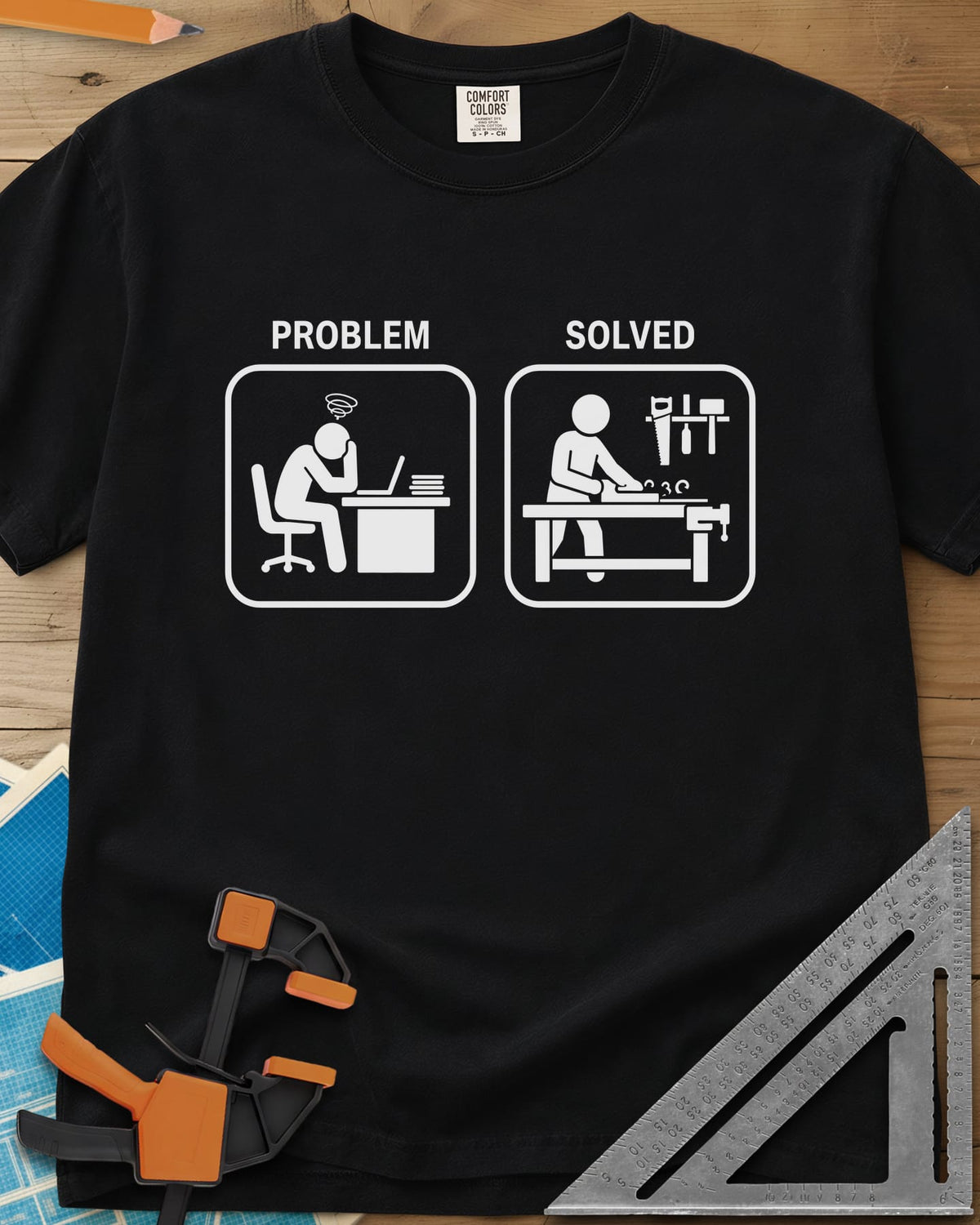 Problem Solved heavyweight tee in Black, two pictogram panels, a stressed desk worker and a woodworker planing
