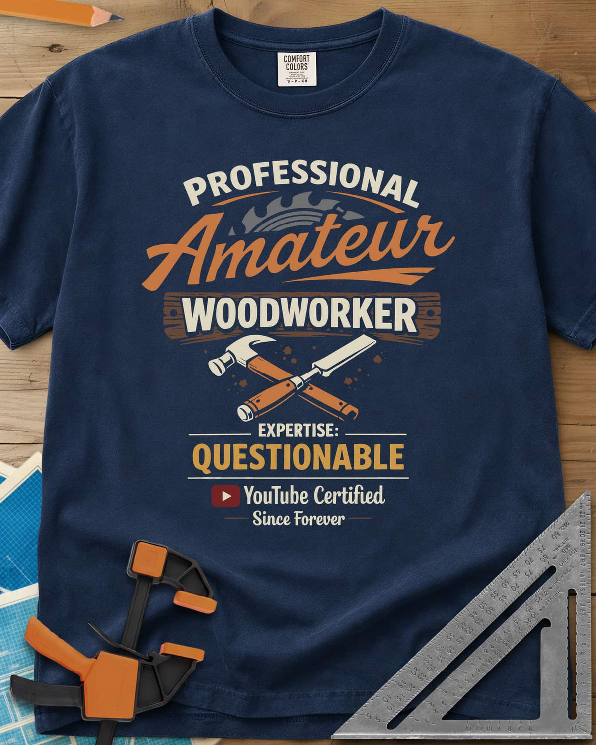 Professional Amateur heavyweight tee in Navy, a saw blade, crossed hammer and chisel, and a YouTube play button