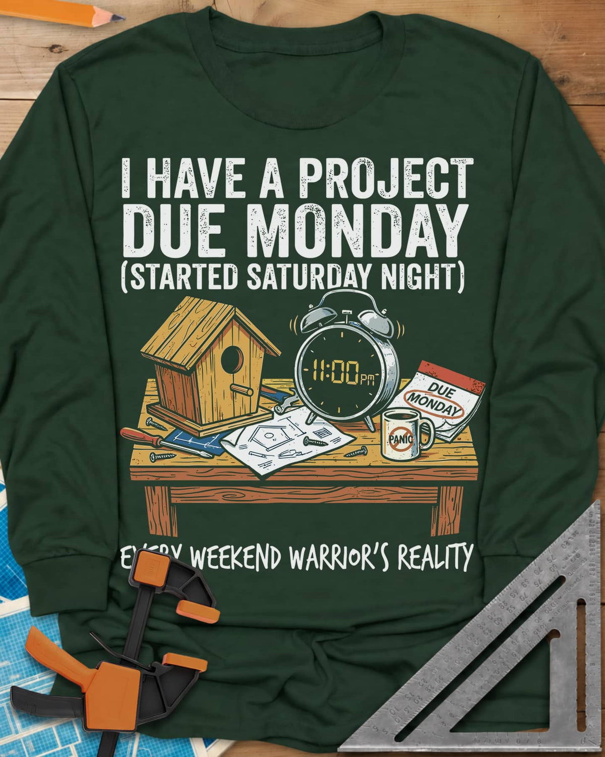 Project Due Monday long sleeve shirt in Forest Green, unfinished birdhouse on a bench with an 11 PM alarm clock and plans