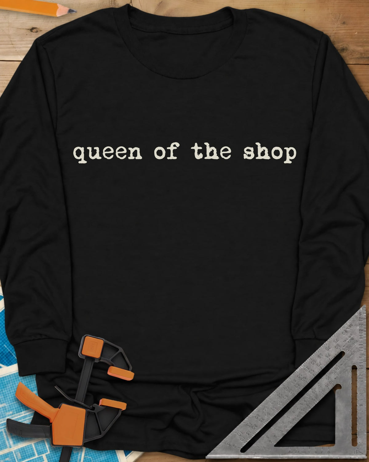 Queen Of The Shop Woodworking long sleeve shirt in Black, small lowercase typewriter lettering, no graphic