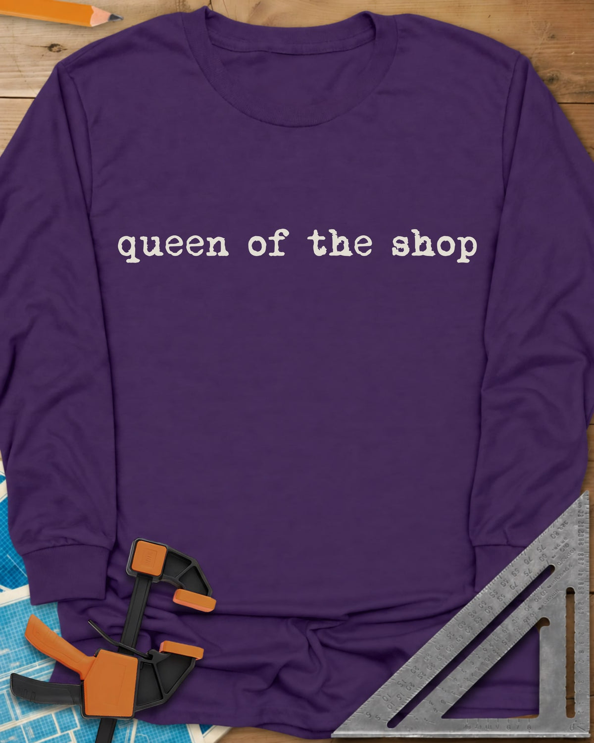 Queen Of The Shop Woodworking long sleeve shirt in Purple, small lowercase typewriter lettering, no graphic
