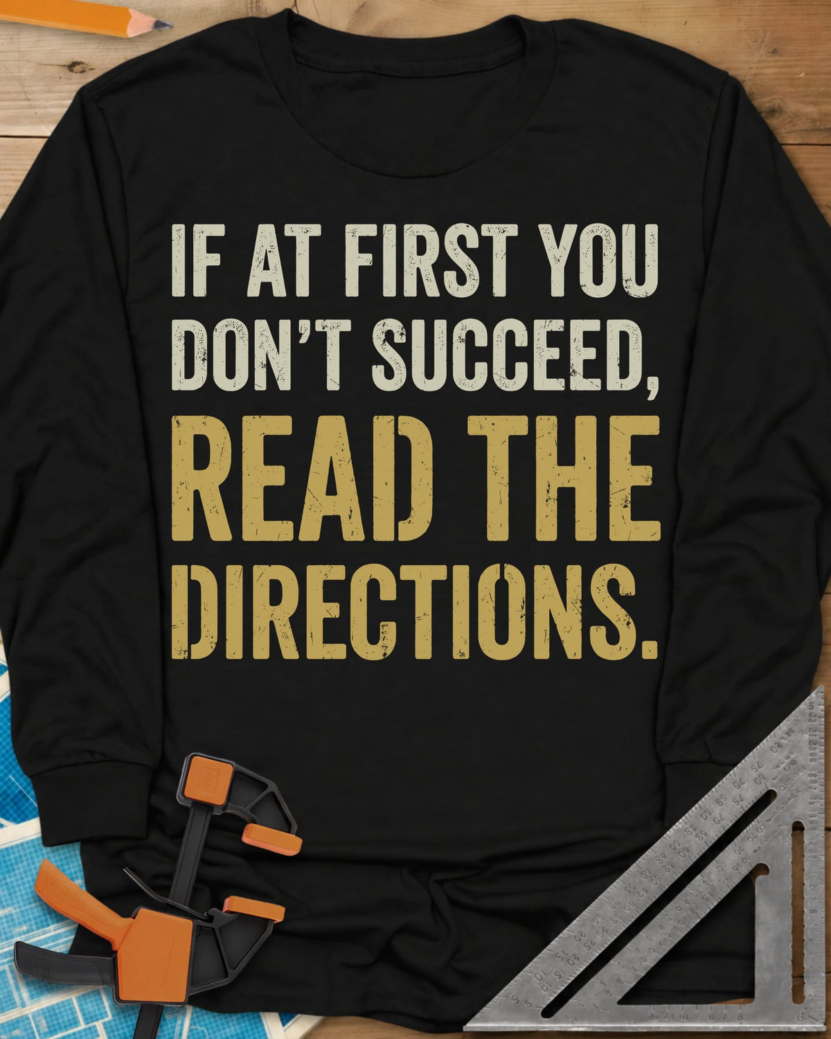 Read The Directions long sleeve shirt in Black, distressed block lettering with READ THE DIRECTIONS in gold