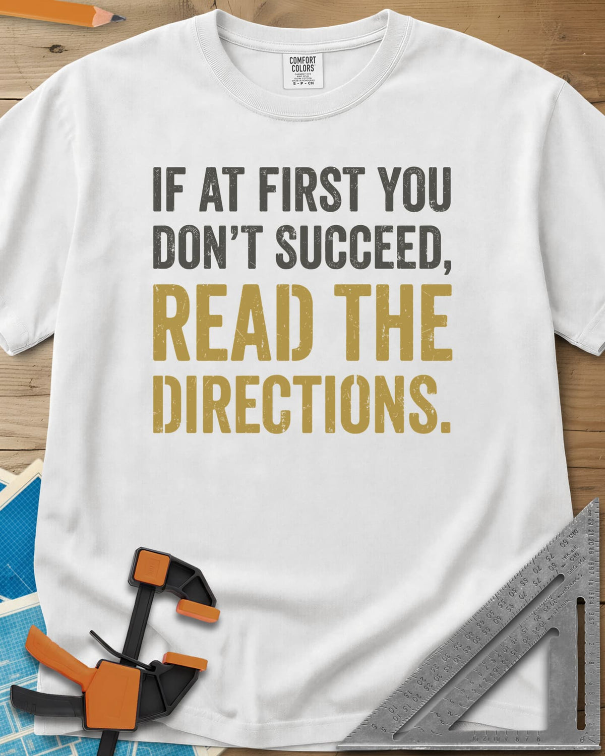 Read The Directions heavyweight tee in White, distressed block lettering with READ THE DIRECTIONS in gold