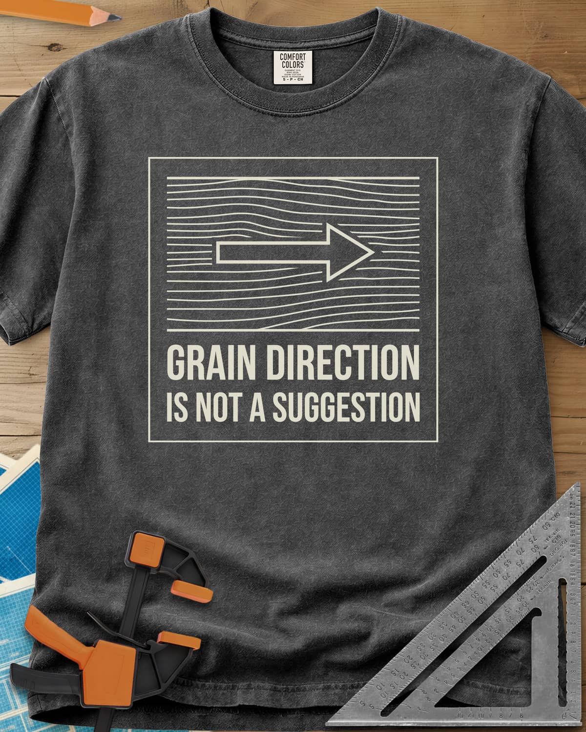 Respect The Grain heavyweight tee in Pepper, boxed wood grain lines with an arrow showing grain direction