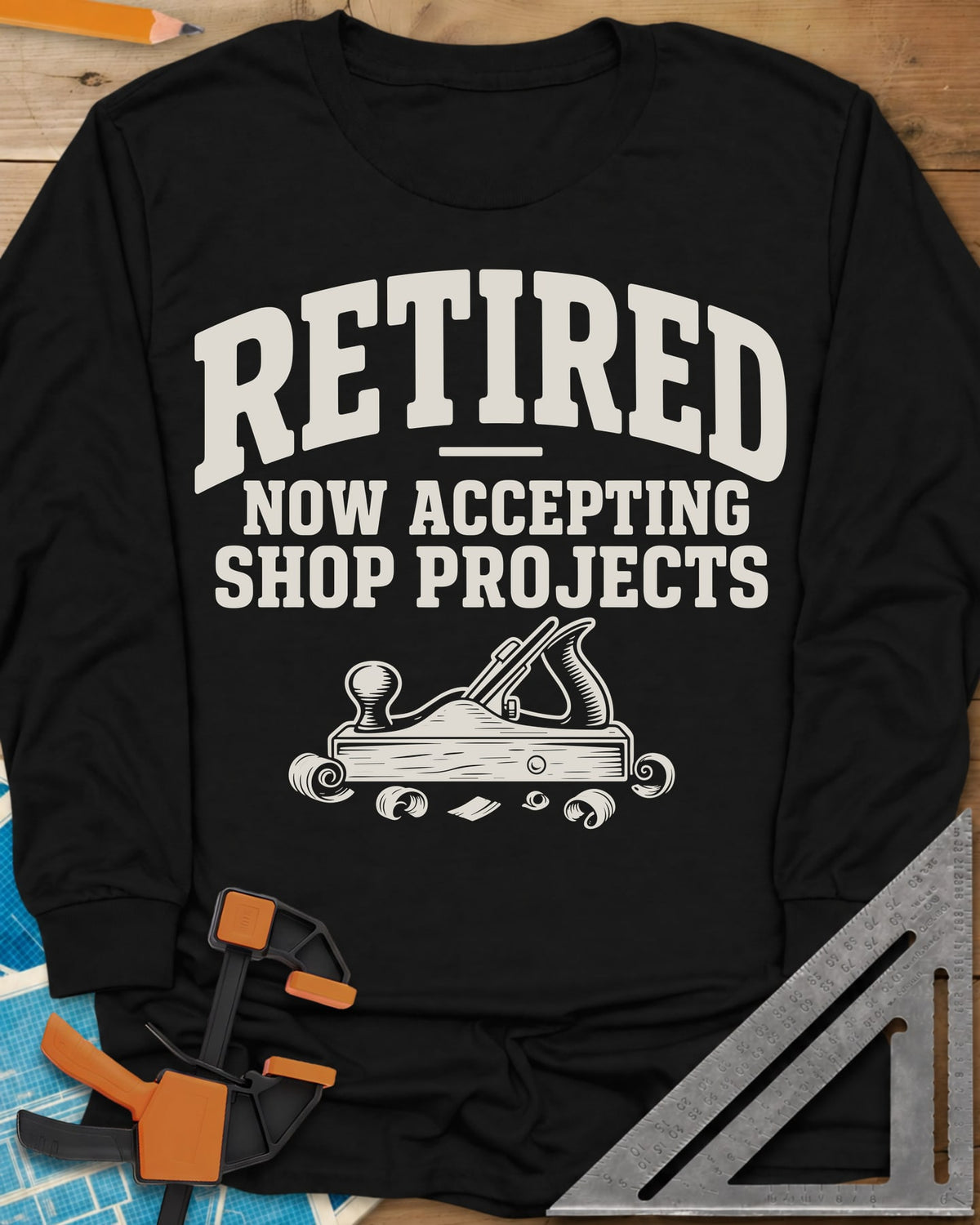 Retired Projects long sleeve shirt in Black, a hand plane with curled shavings under varsity RETIRED lettering