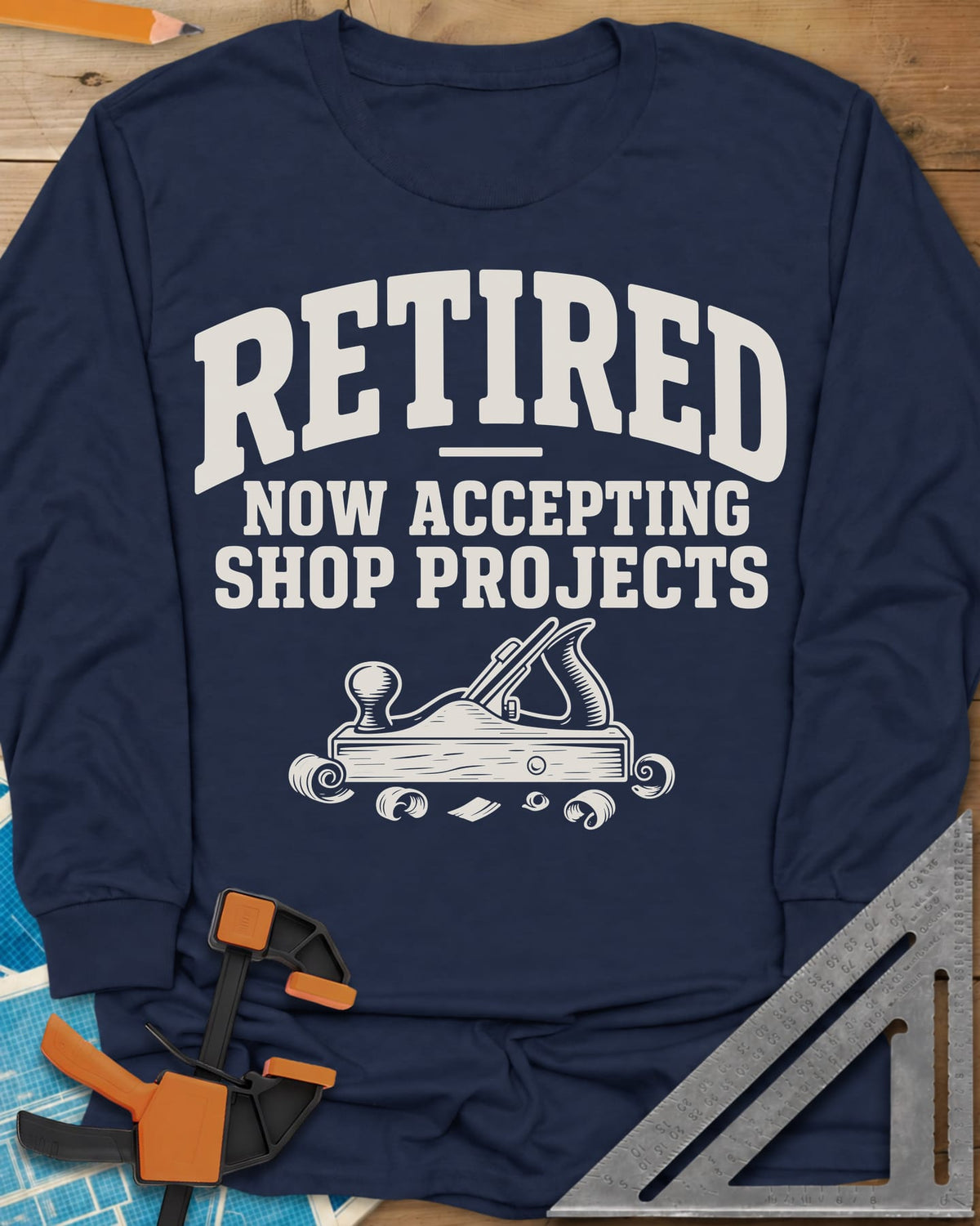 Retired Projects long sleeve shirt in Navy, a hand plane with curled shavings under varsity RETIRED lettering