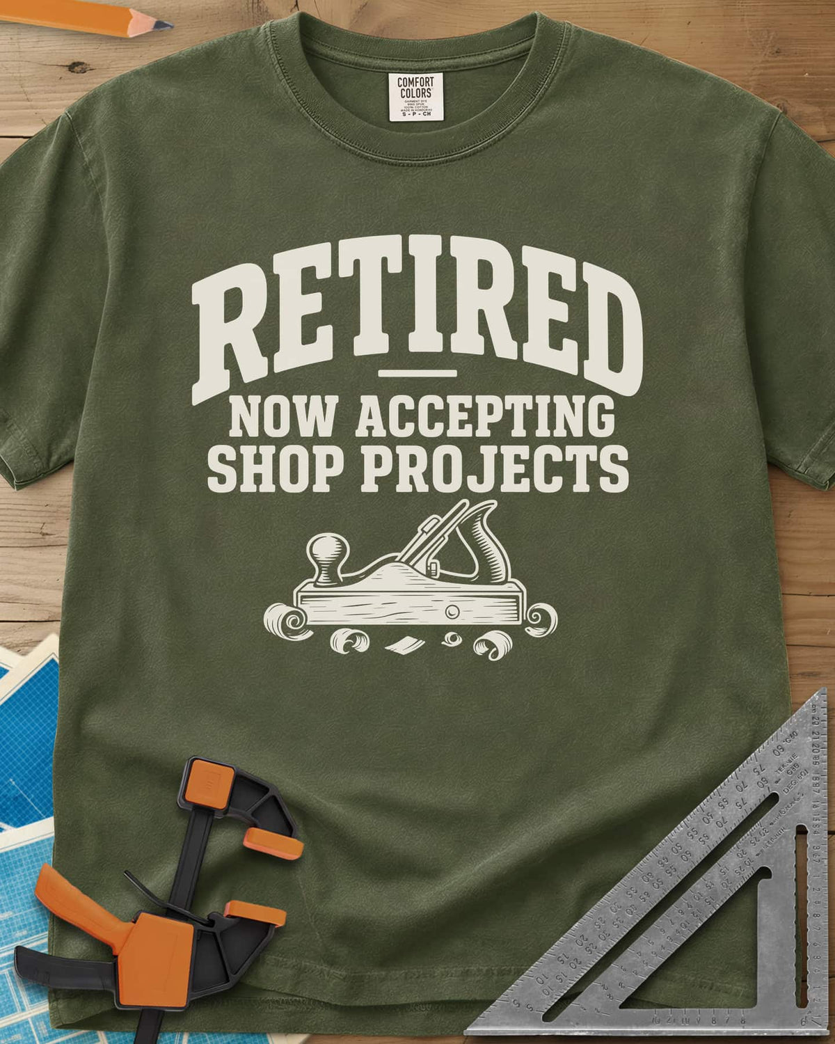 Retired Projects heavyweight tee in Hemp, a hand plane with curled shavings under varsity RETIRED lettering