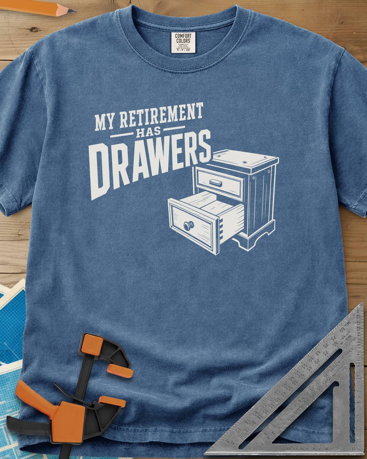 Retirement Drawers heavyweight tee in Blue Jean, a small chest of drawers with one drawer pulled open
