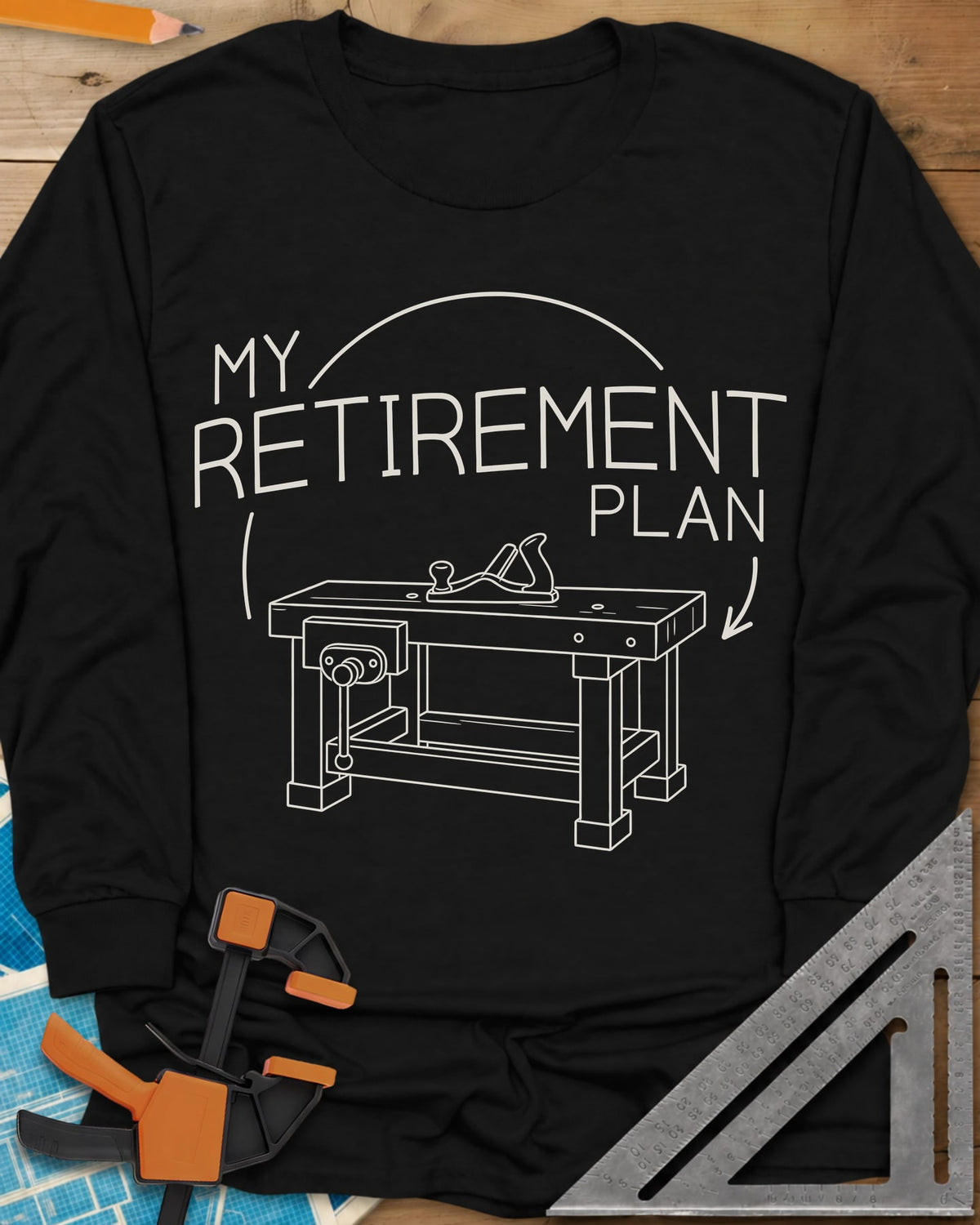 Retirement Plan long sleeve shirt in Black, line drawing of a woodworking bench with a vise and hand plane