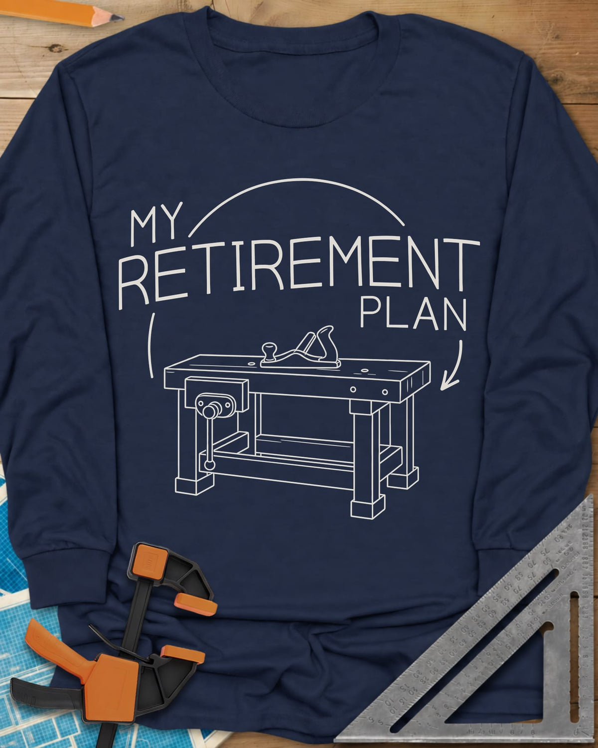 Retirement Plan long sleeve shirt in Navy, line drawing of a woodworking bench with a vise and hand plane