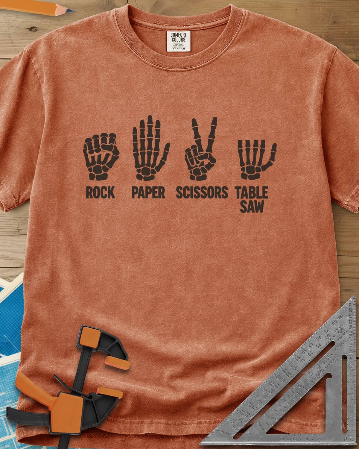 Rock Paper Saw heavyweight tee in Yam, four skeleton hands, the last with its fingers cut short