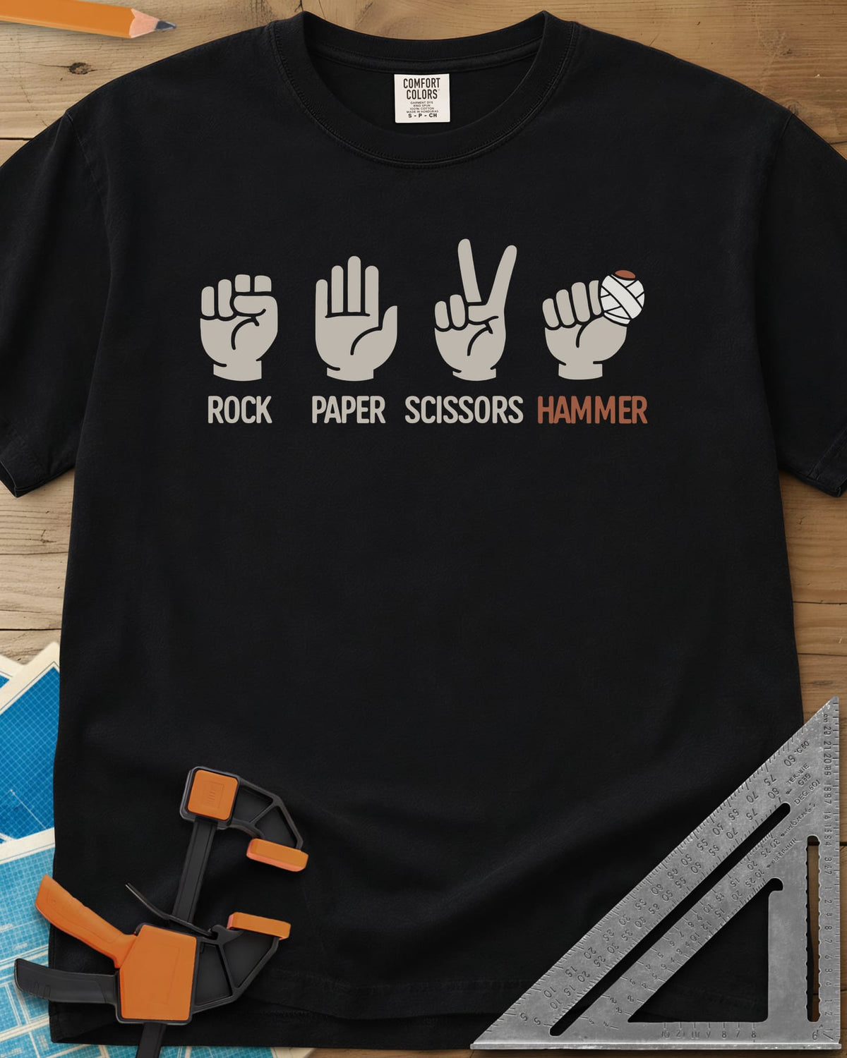 Rock, Paper, Scissors, Hammer heavyweight tee in Black, four hand signs, the last a fist with a bandaged thumb