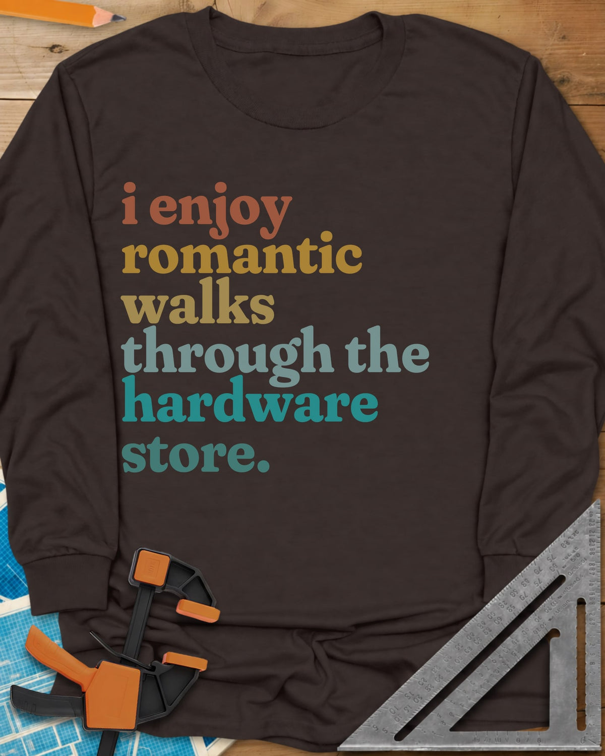 Romantic Walks long sleeve shirt in Dark Chocolate, stacked lowercase words in rust, mustard, sage and teal