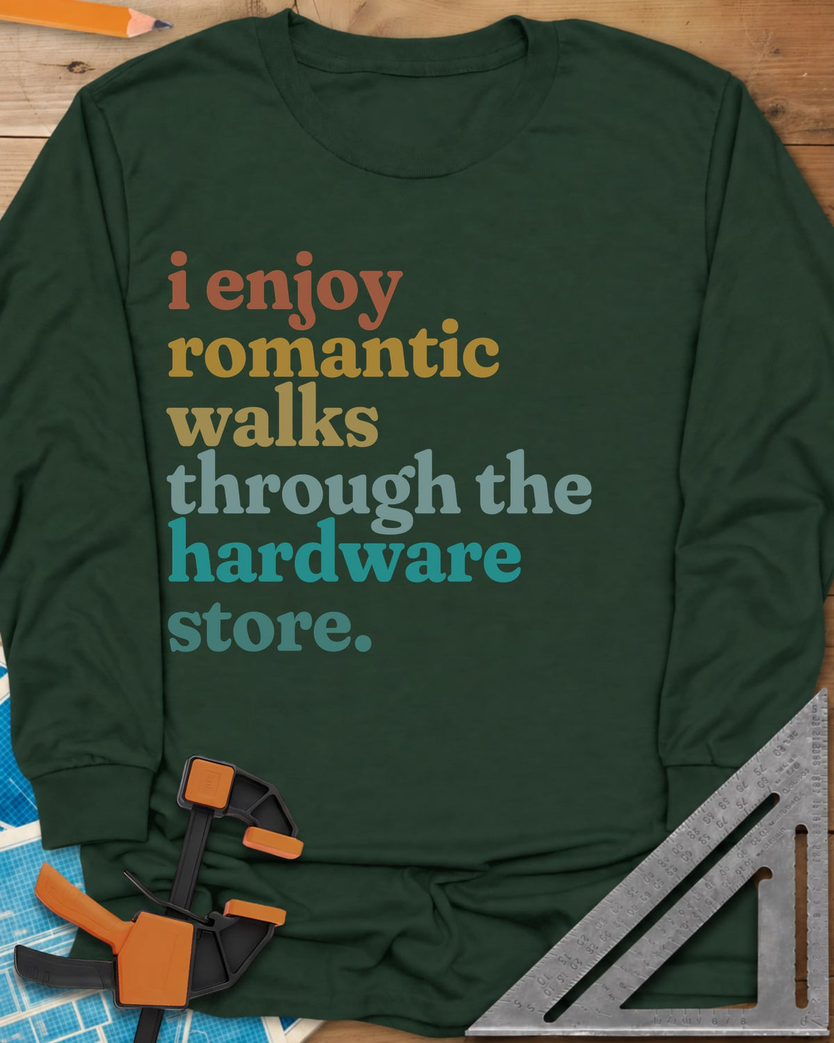Romantic Walks long sleeve shirt in Forest Green, stacked lowercase words in rust, mustard, sage and teal